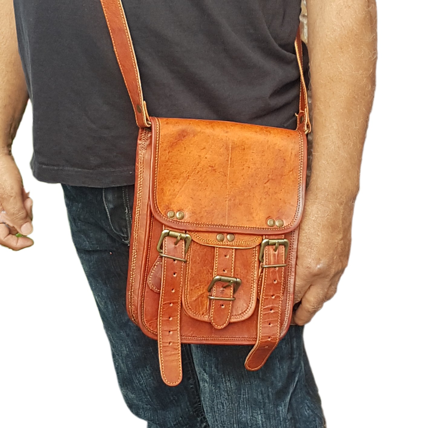 Leather messenger bag 10 by 7.5 inches with an adjustable cross body strap. Solid brass magnet buckles for easy opening & closing. Lined.