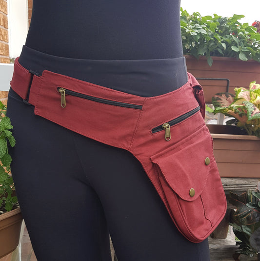 Utility festival belt in maroon. Unisex travel & shopping money belt. Adjustable to 48 inches. 6 pockets-4 zip, 2 cargo . Handy coin pouch.