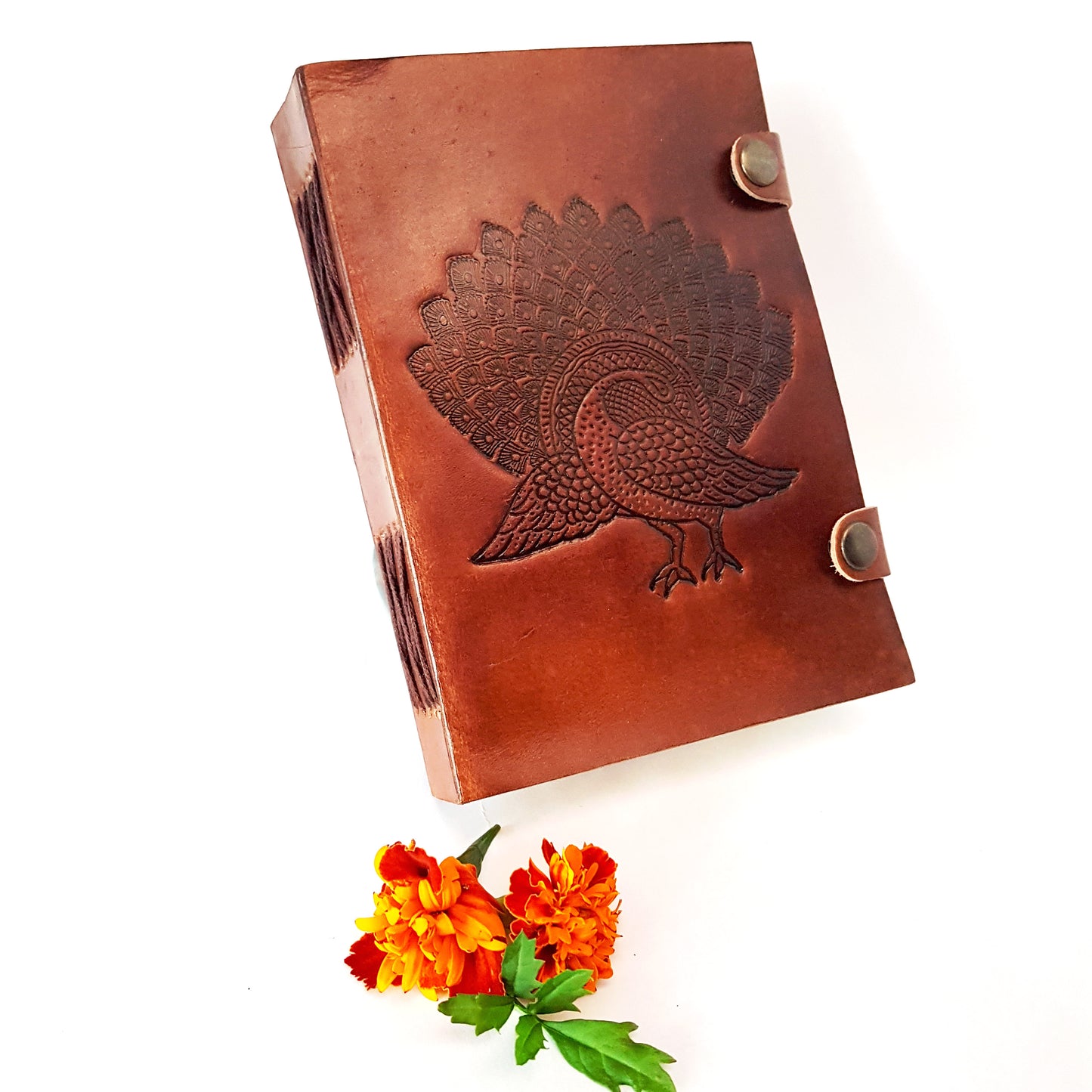 Leather bound journal with peacock design embossed cover. Bird of love motif 5 by 7 inch.