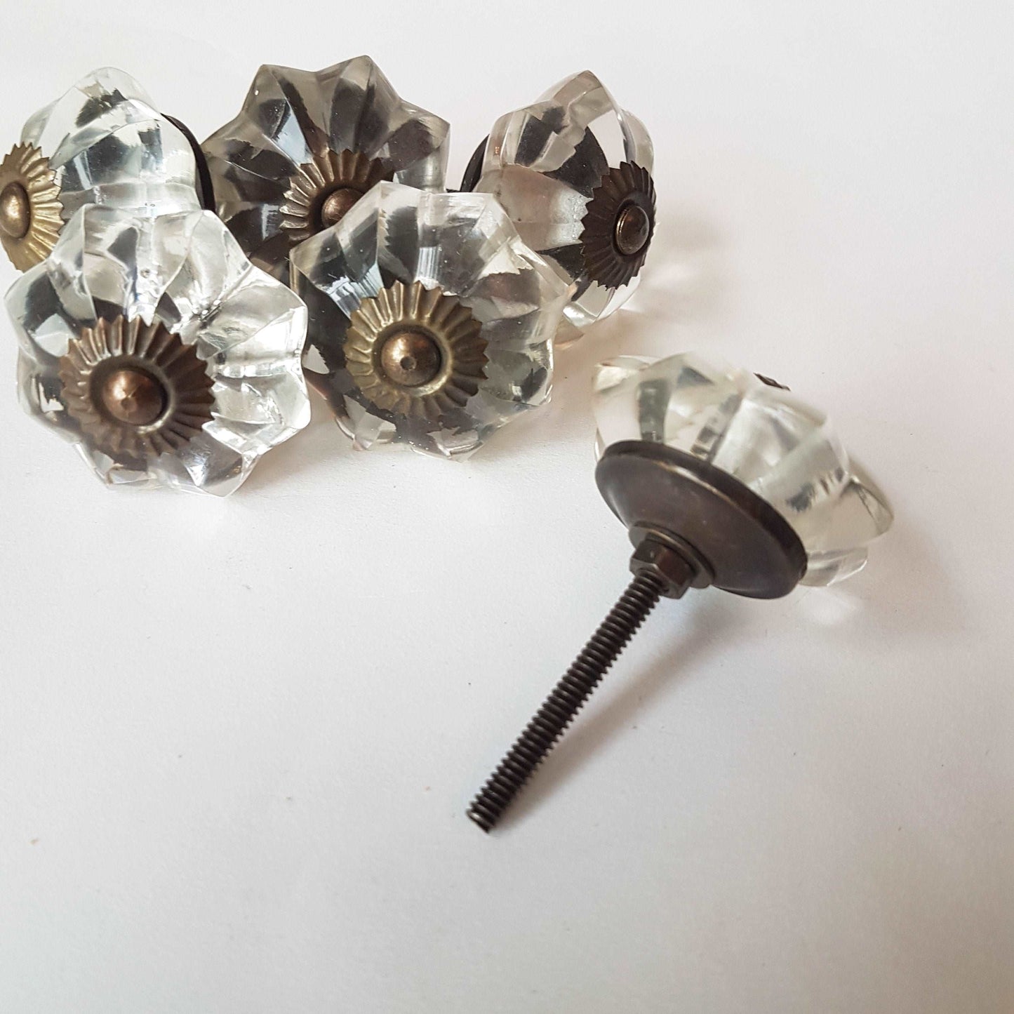 12 clear crystal cabinet knobs. Cut glass pulls in melon shape.