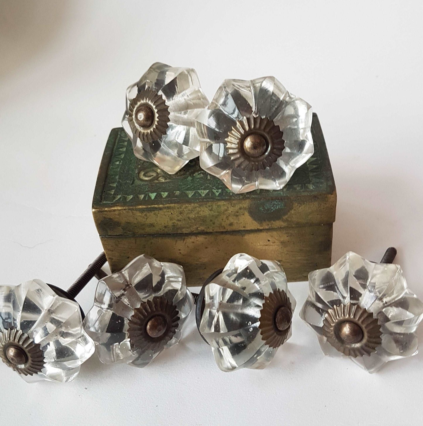 12 clear crystal cabinet knobs. Cut glass pulls in melon shape.