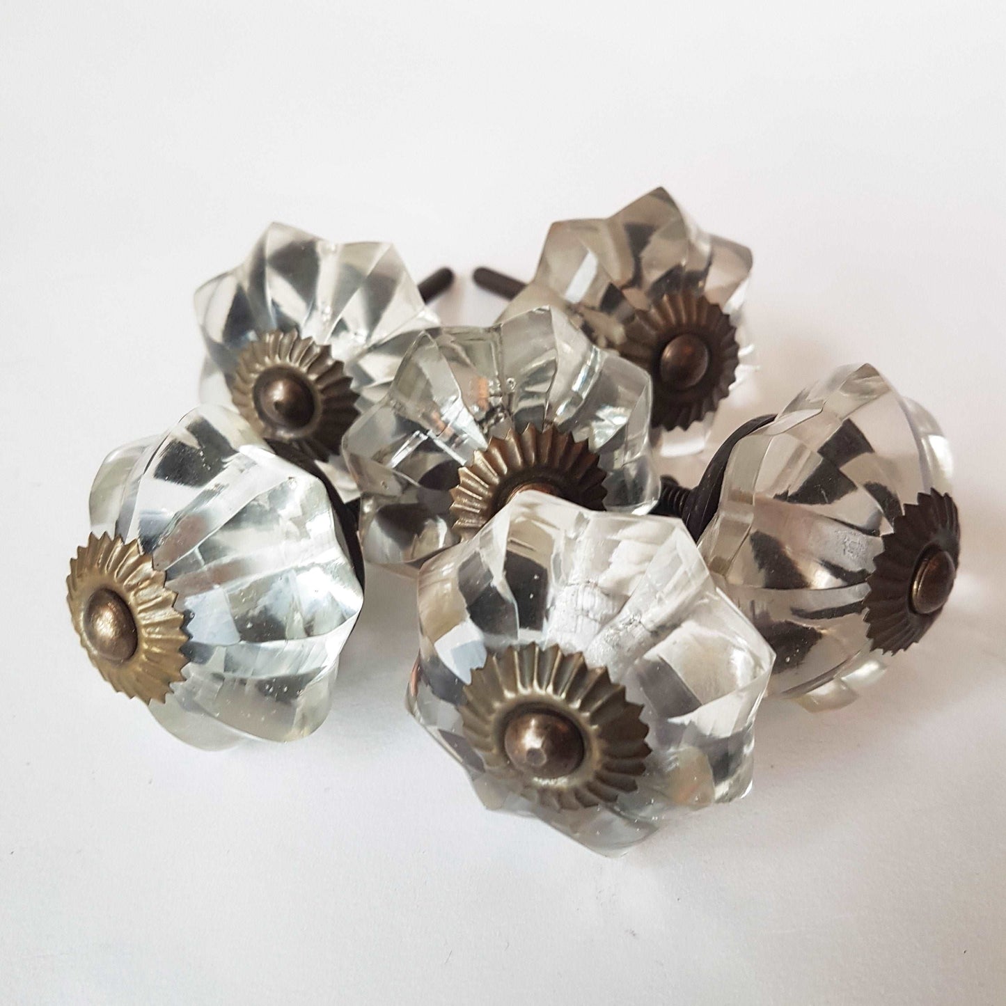 12 clear crystal cabinet knobs. Cut glass pulls in melon shape.