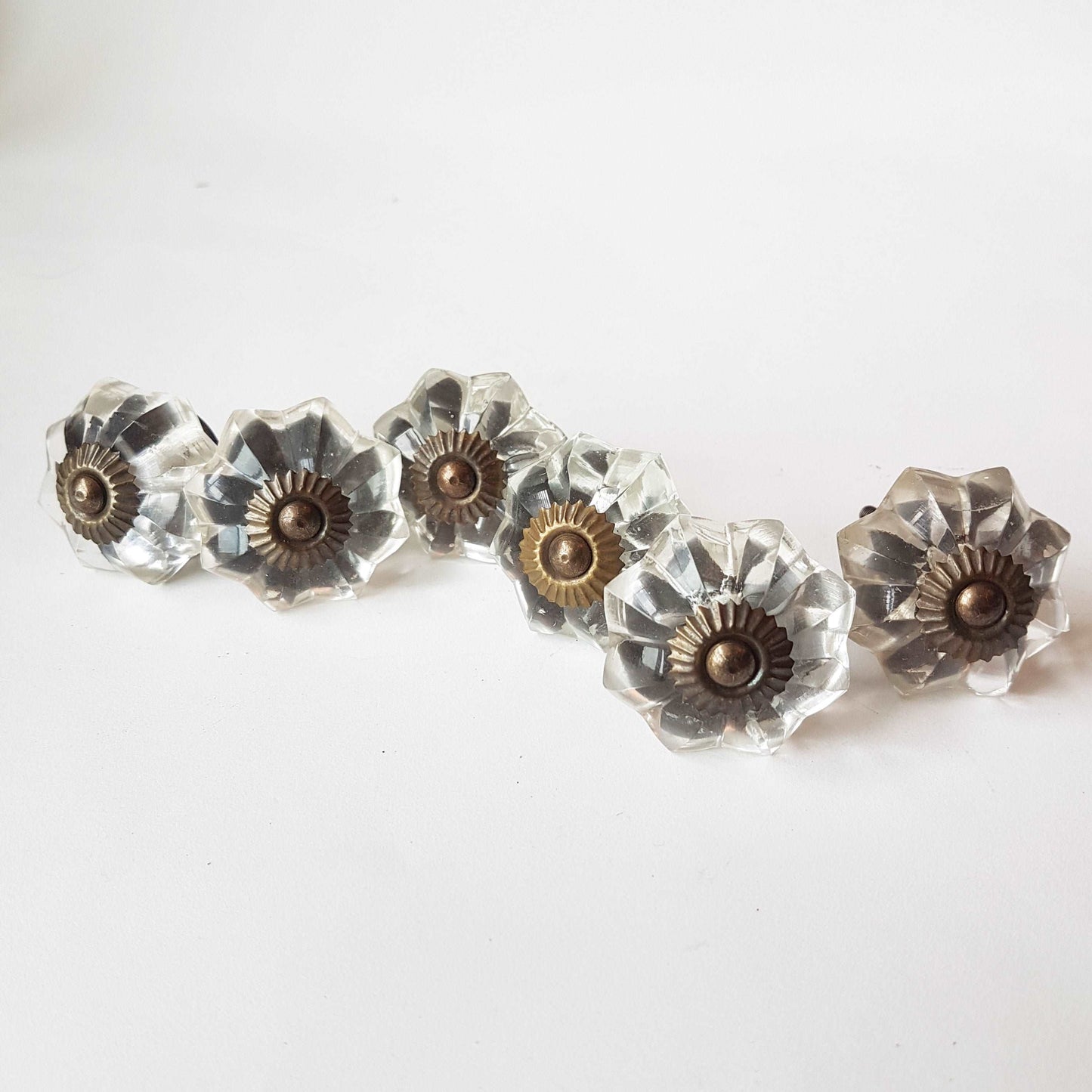 12 clear crystal cabinet knobs. Cut glass pulls in melon shape.