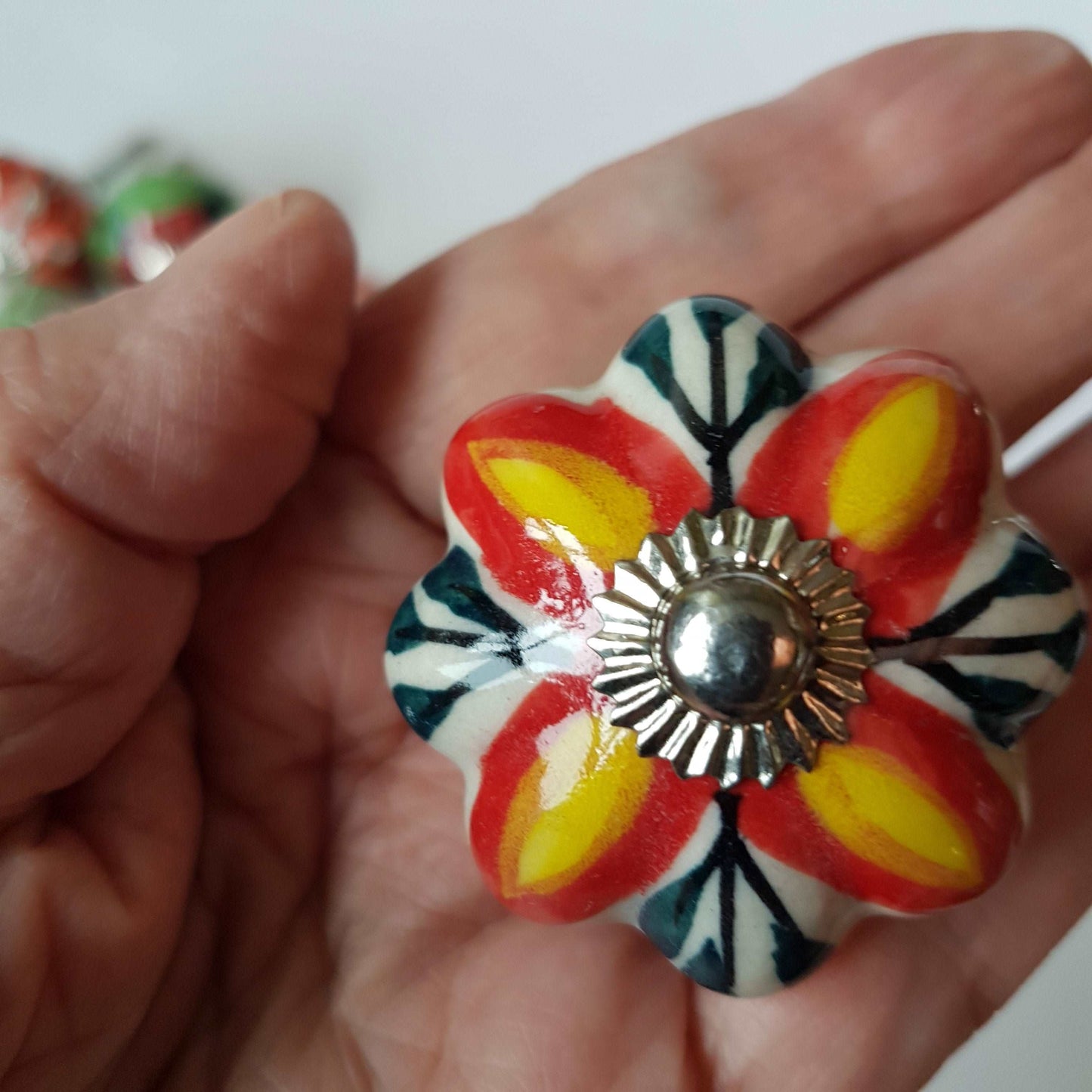 6 cabinet knobs Dolce exclusive collection. Hand painted floral ceramic art. Drawer pulls. one and one half inches in diameter