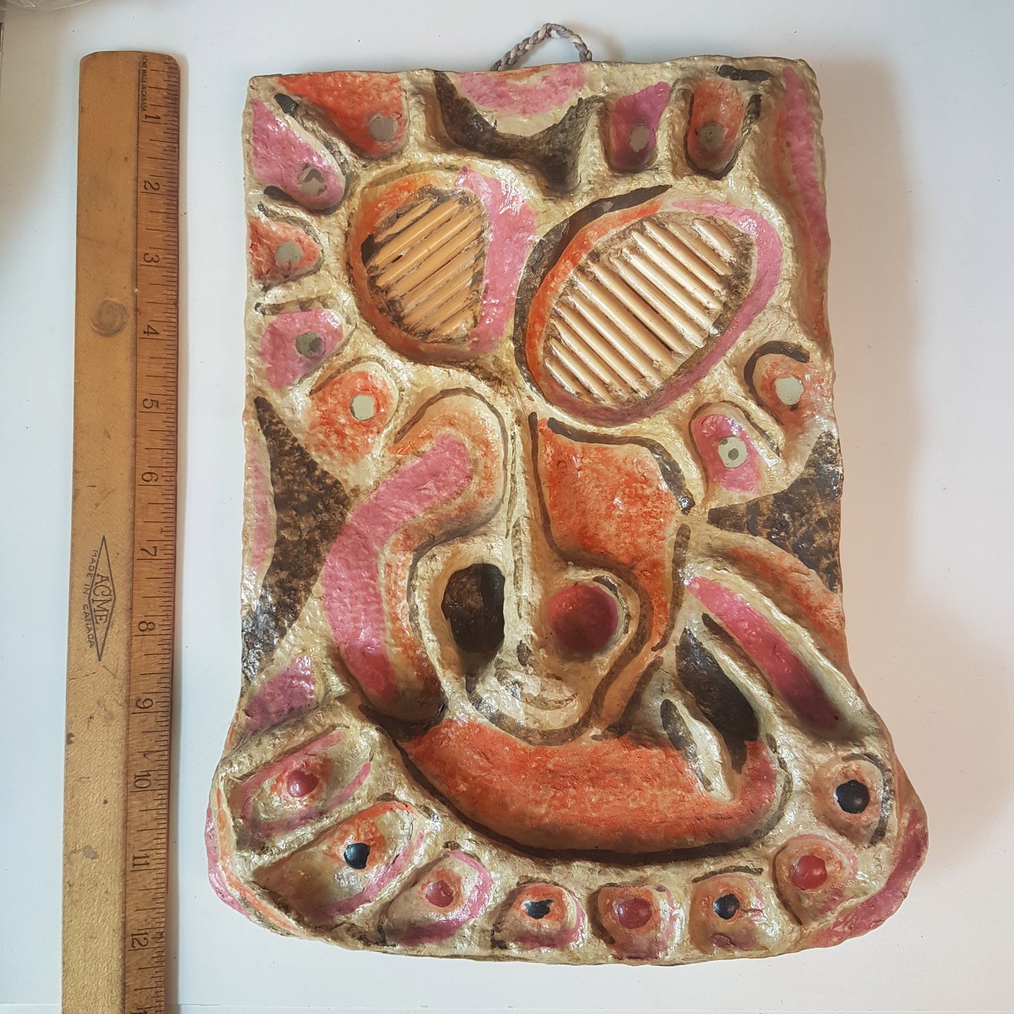 Vintage mixed media wall art mask. Pink and orange. 12 inches high.