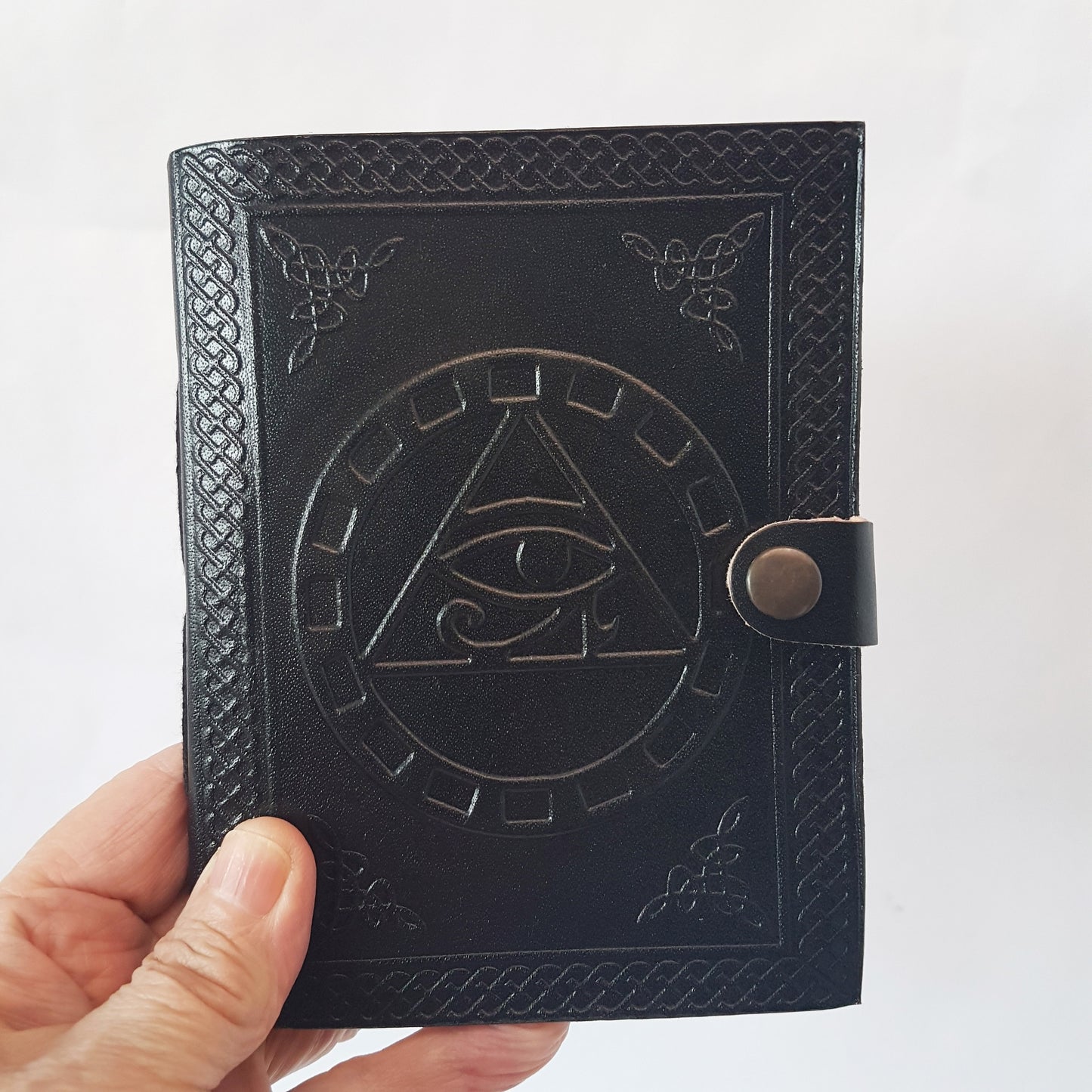 Black Leather bound blank book with an embossed Eye of Horus cover.