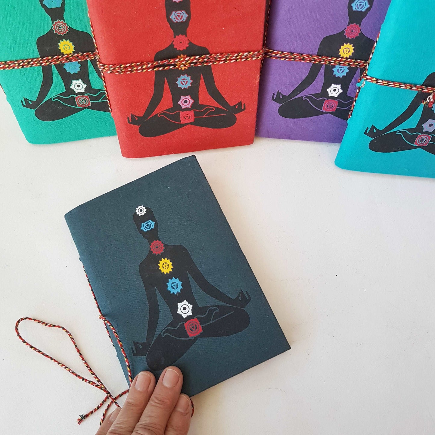 7 Chakra design hand bound journal with lined pages. Slate gray fabric cover journal 5 by 7 inches. Hardcover notebook with yoga design.