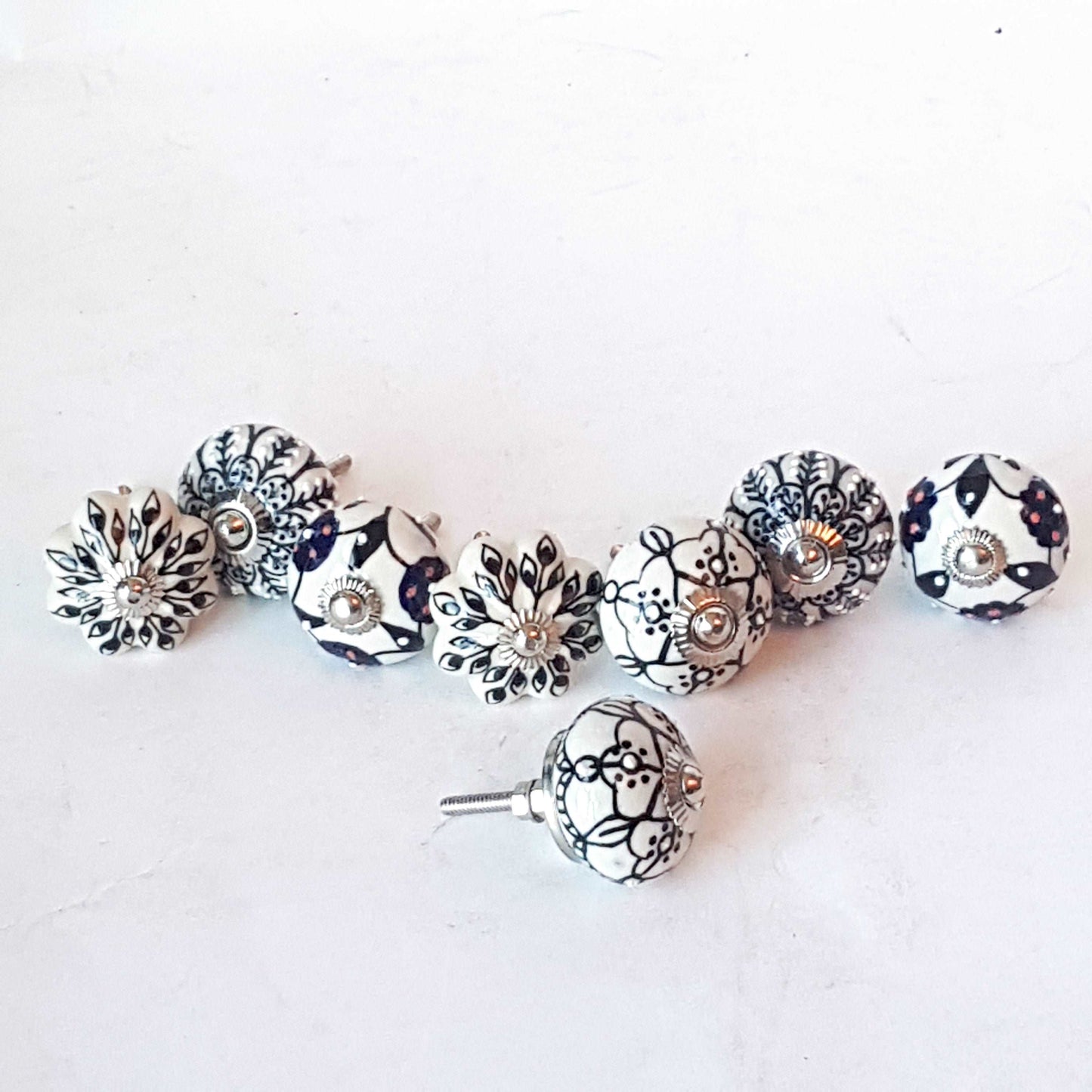 Andromeda set of 8 hand painted cabinet drawer knobs with botanical patterns in black & white. Exclusive designer collection. In stock now!