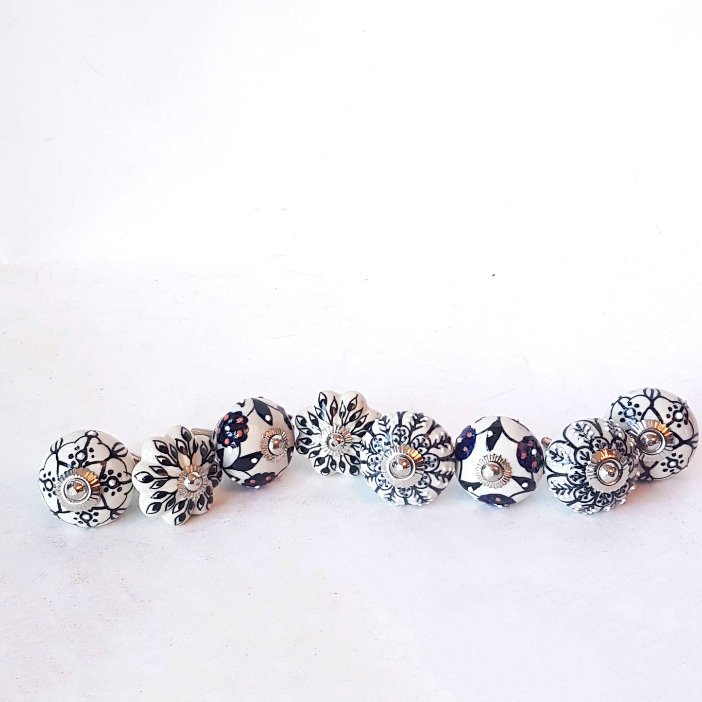 Andromeda set of 8 hand painted cabinet drawer knobs with botanical patterns in black & white. Exclusive designer collection. In stock now!