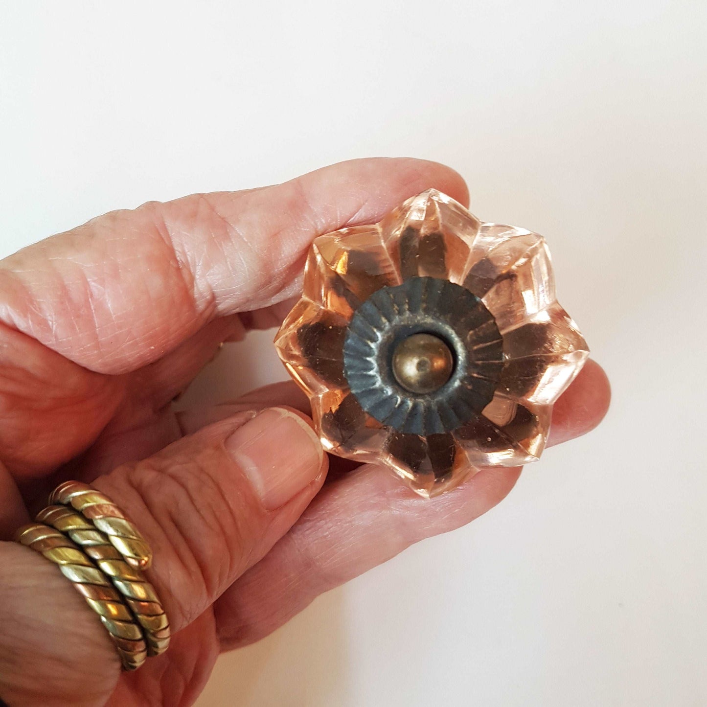 8 cranberry glass cabinet knobs with antique finish bronze centers. Transparent pink cut glass drawer pulls. Furniture hardware. 1.5 inch.