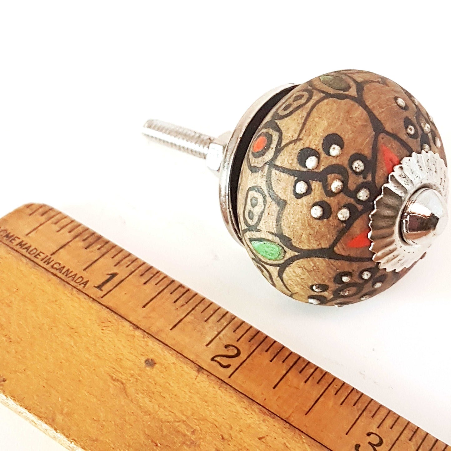 8 cabinet knobs hand painted in rustic country designs. Black & brown floral patterns with silver hardware. Easy and affordable DIY decor.