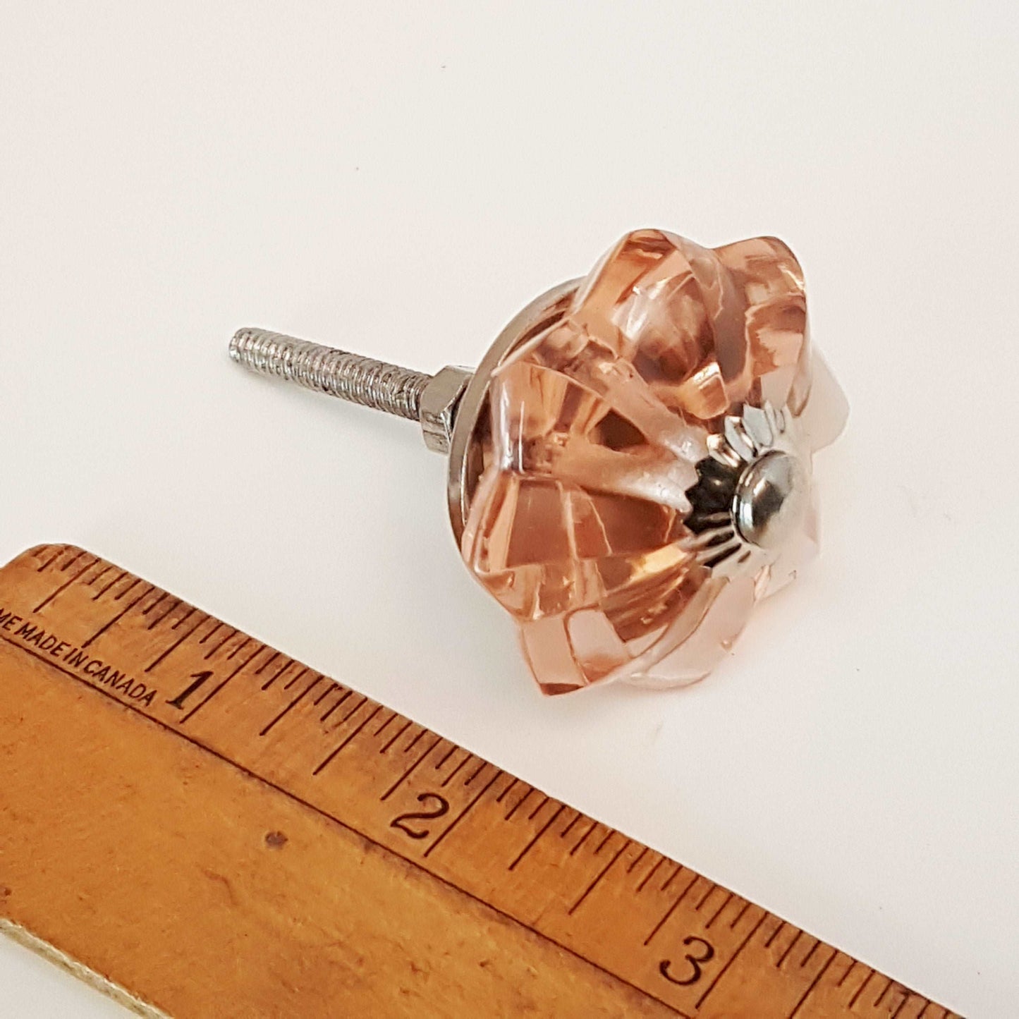 8 cranberry glass cabinet knobs with silver centers. Transparent pink cut glass drawer pulls. For kitchen cupboards, dressers, vanities.