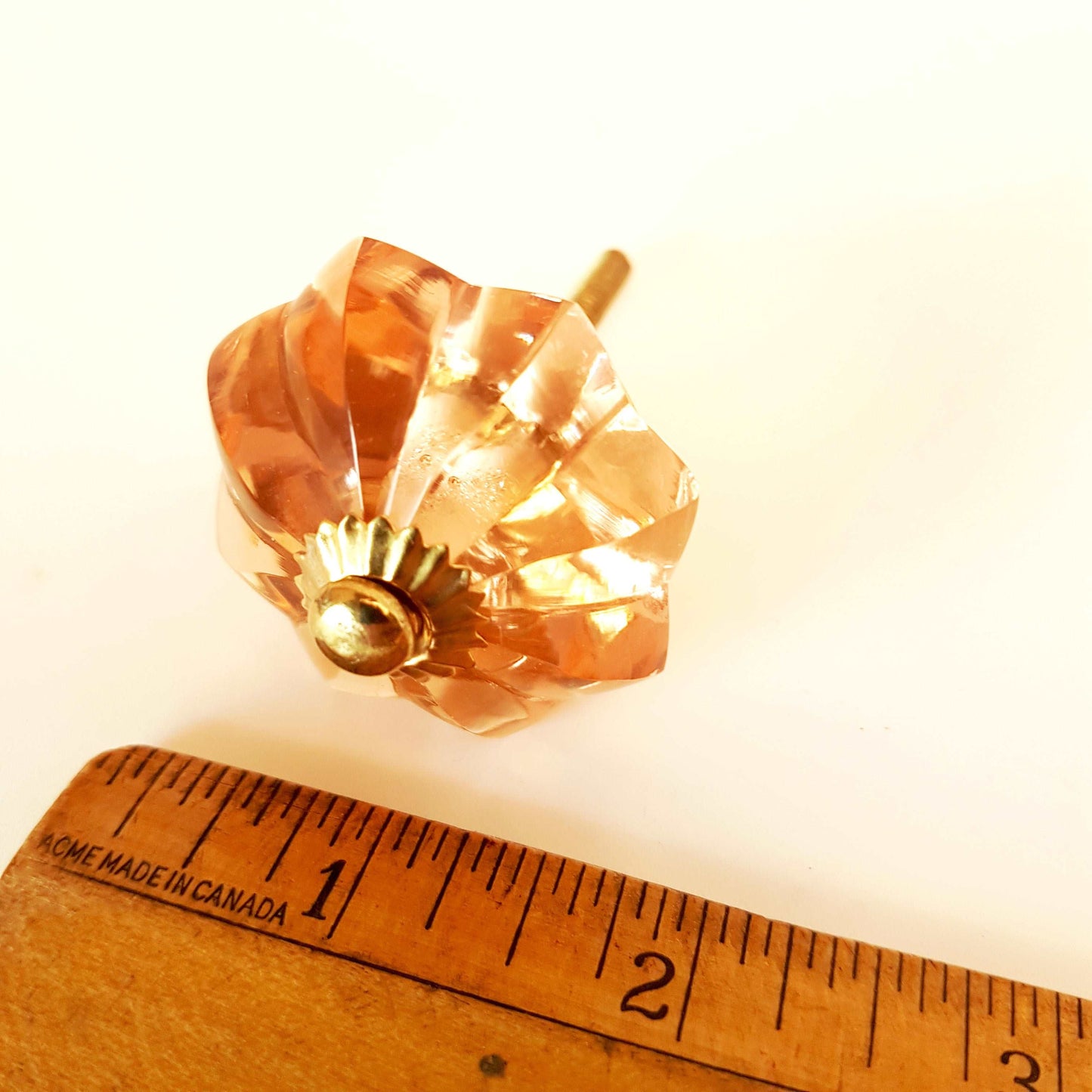 8 cranberry glass cabinet knobs with gold tone accents. Pink crystal look cut glass drawer pulls. For kitchen cupboards, dressers, vanities.