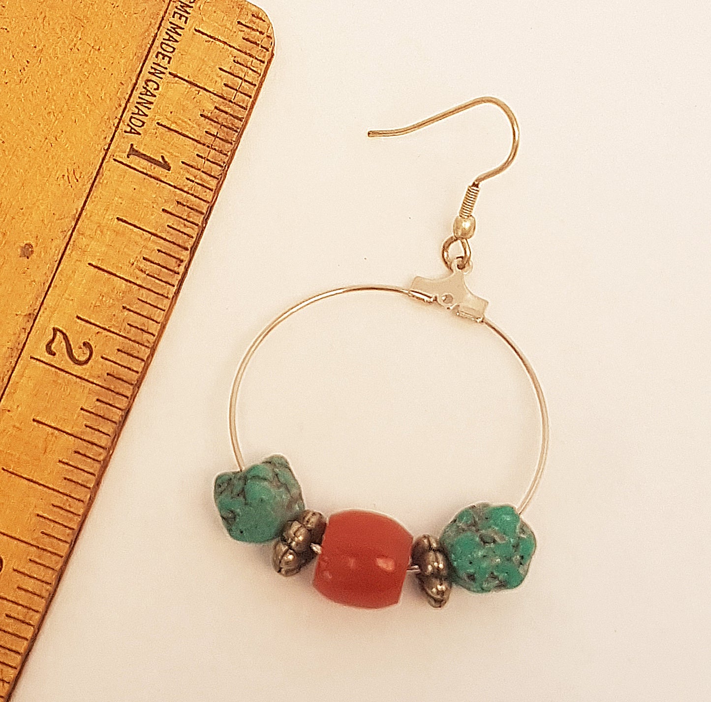Silver hoop earrings with coral beads & raw turquoise stones.