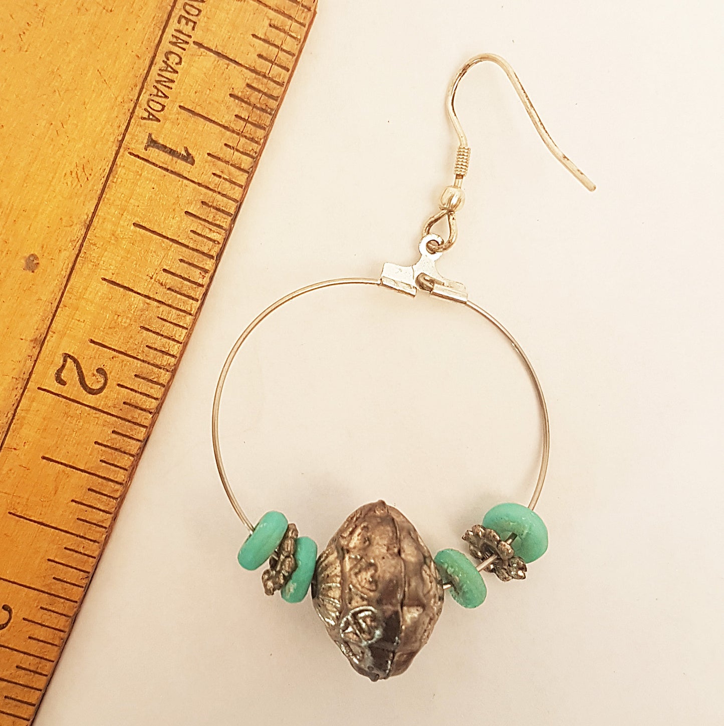 Silver hoop earrings with antique design silver & turquoise beads.