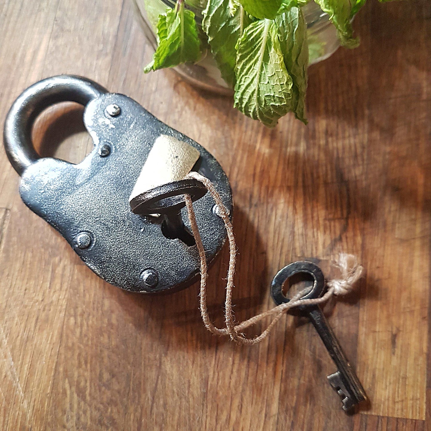 Antique finish bronze metal pad lock. Padlock 3.75 by 2 inches with 2 vintage keys. Unique old world design. Functional lock collectible.