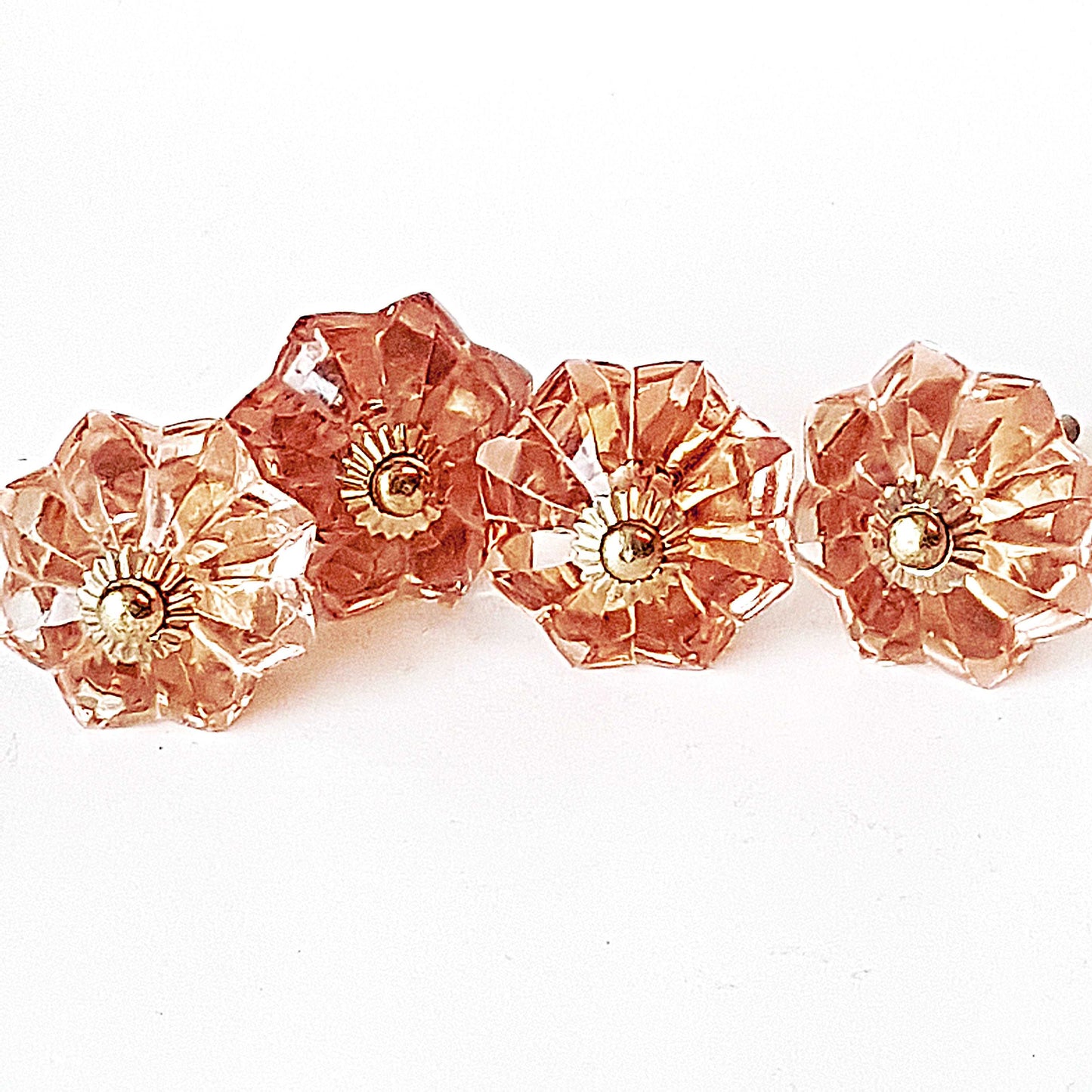 8 cranberry glass cabinet knobs with gold tone accents. Pink crystal look cut glass drawer pulls. For kitchen cupboards, dressers, vanities.