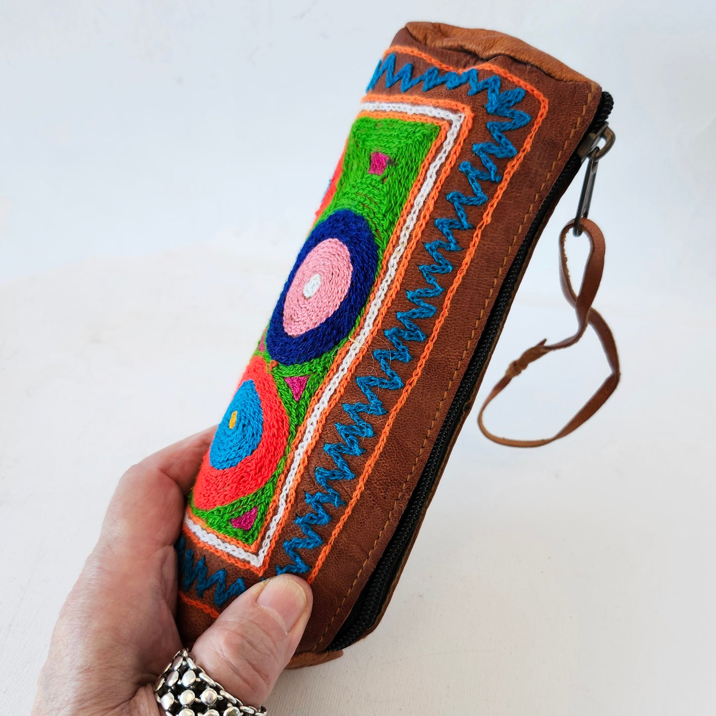 Leather Tube Pouch with a Colorful Hand Embroidered Boho Hippie design.