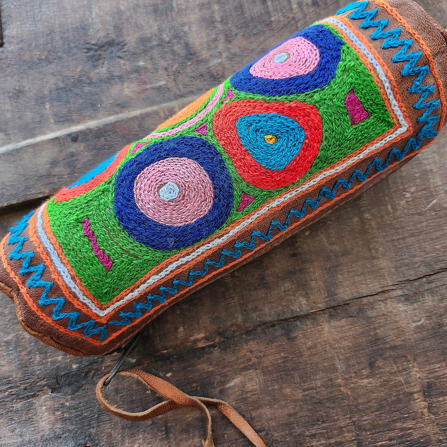 Leather Tube Pouch with a Colorful Hand Embroidered Boho Hippie design.
