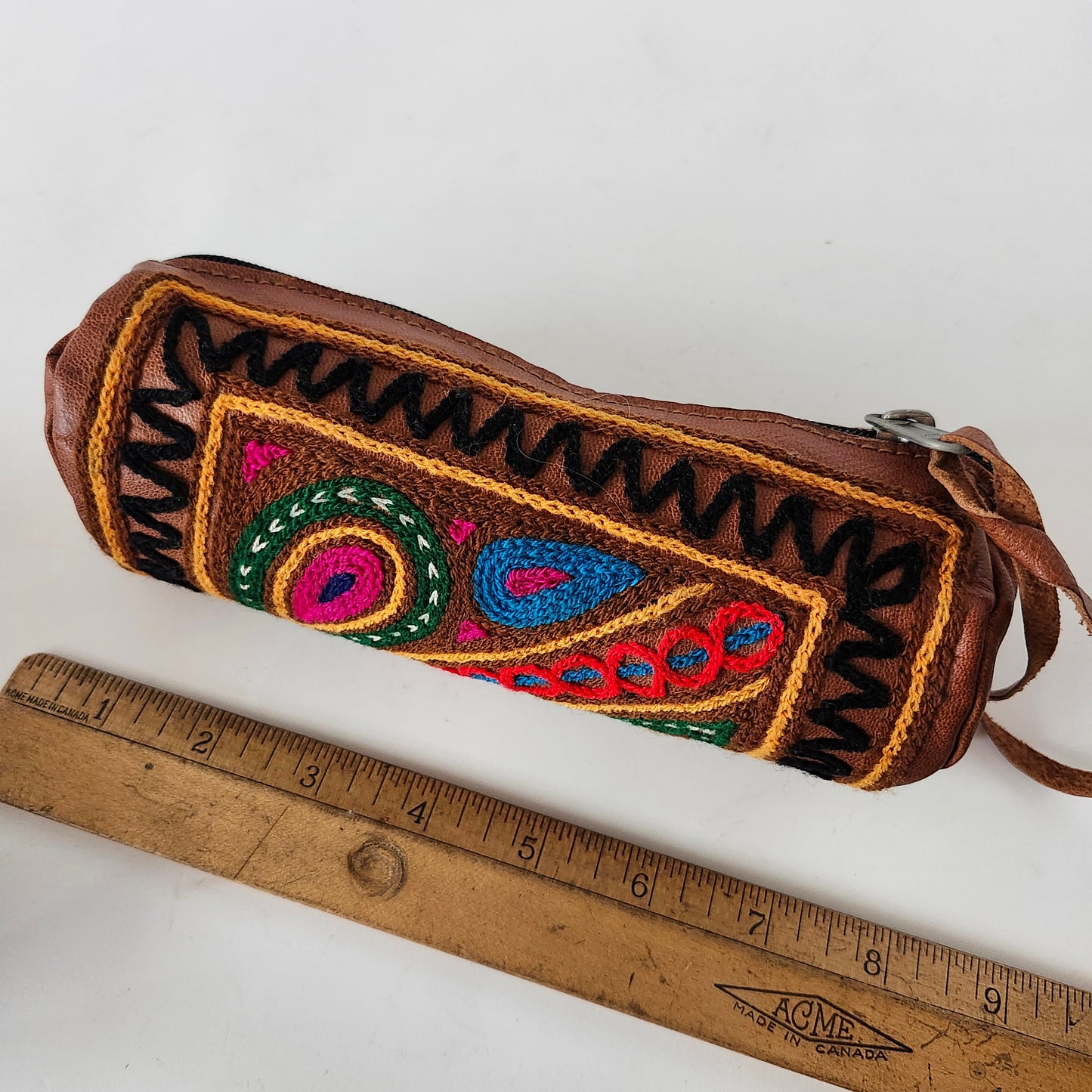 Leather Tube Pouch with a Colorful Hand Embroidered Boho Hippie design.