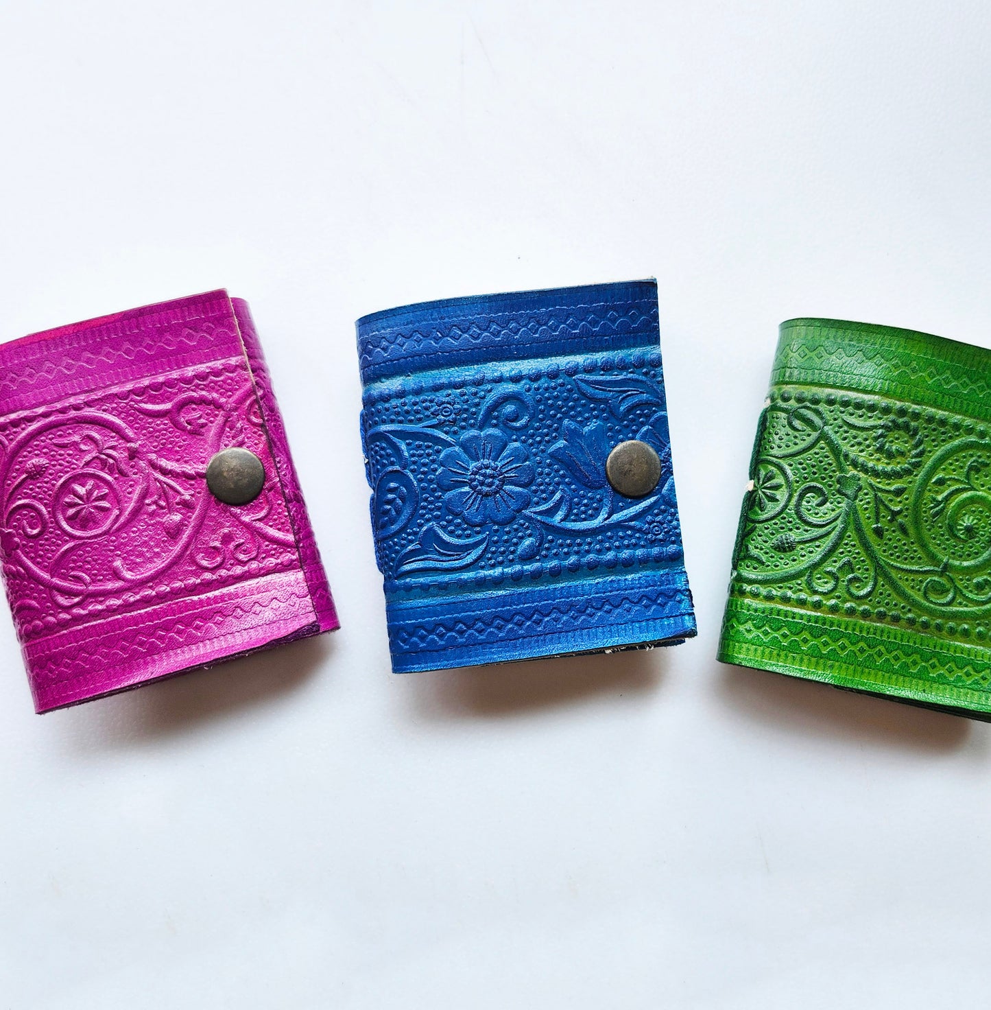 Set of 3 Colorful Engraved Leather 3 Inch Pocket Diaries.