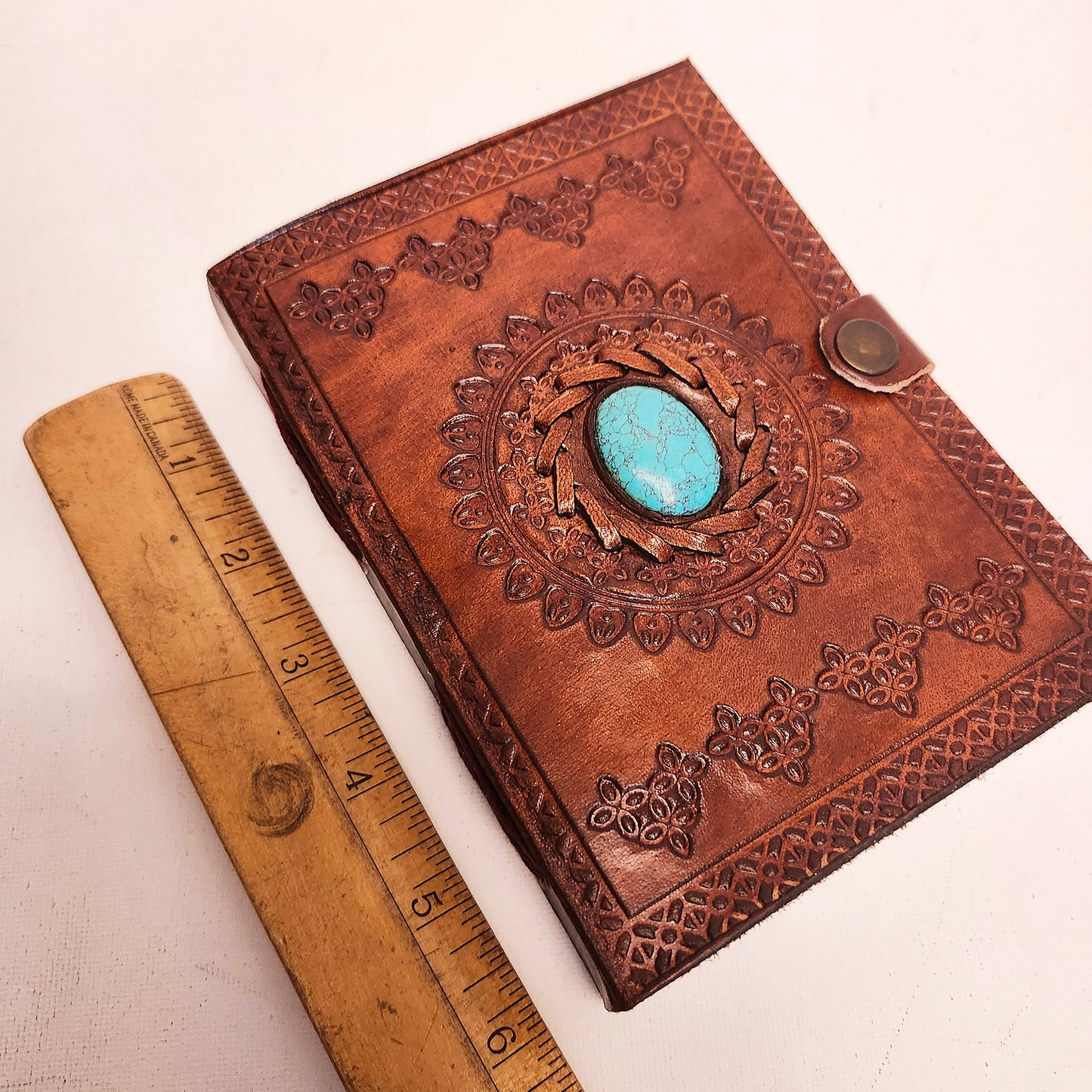 Brown Leather Bound Blank Page Journal with a Turquoise Center Gemstone.
