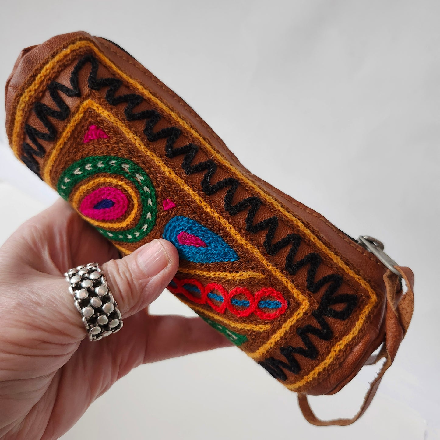 Leather Tube Pouch with a Colorful Hand Embroidered Boho Hippie design.