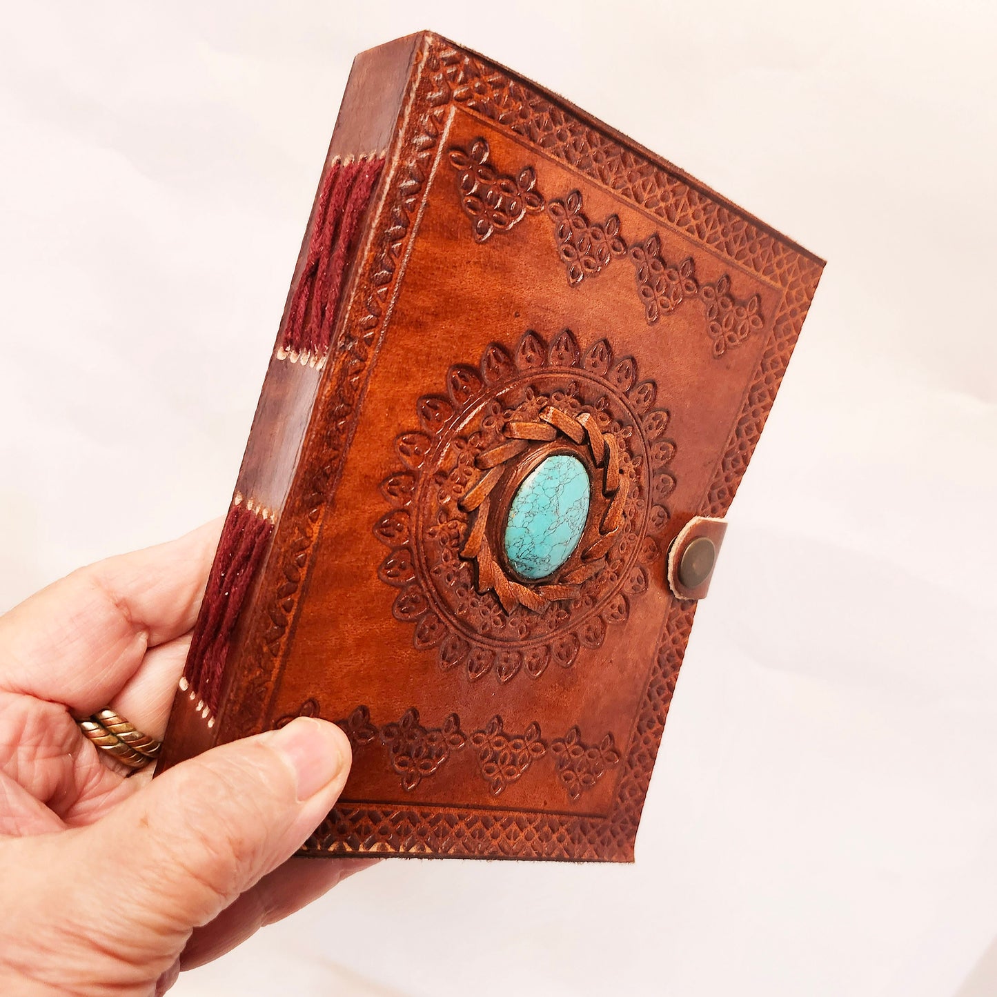 Brown Leather Bound Blank Page Journal with a Turquoise Center Gemstone.