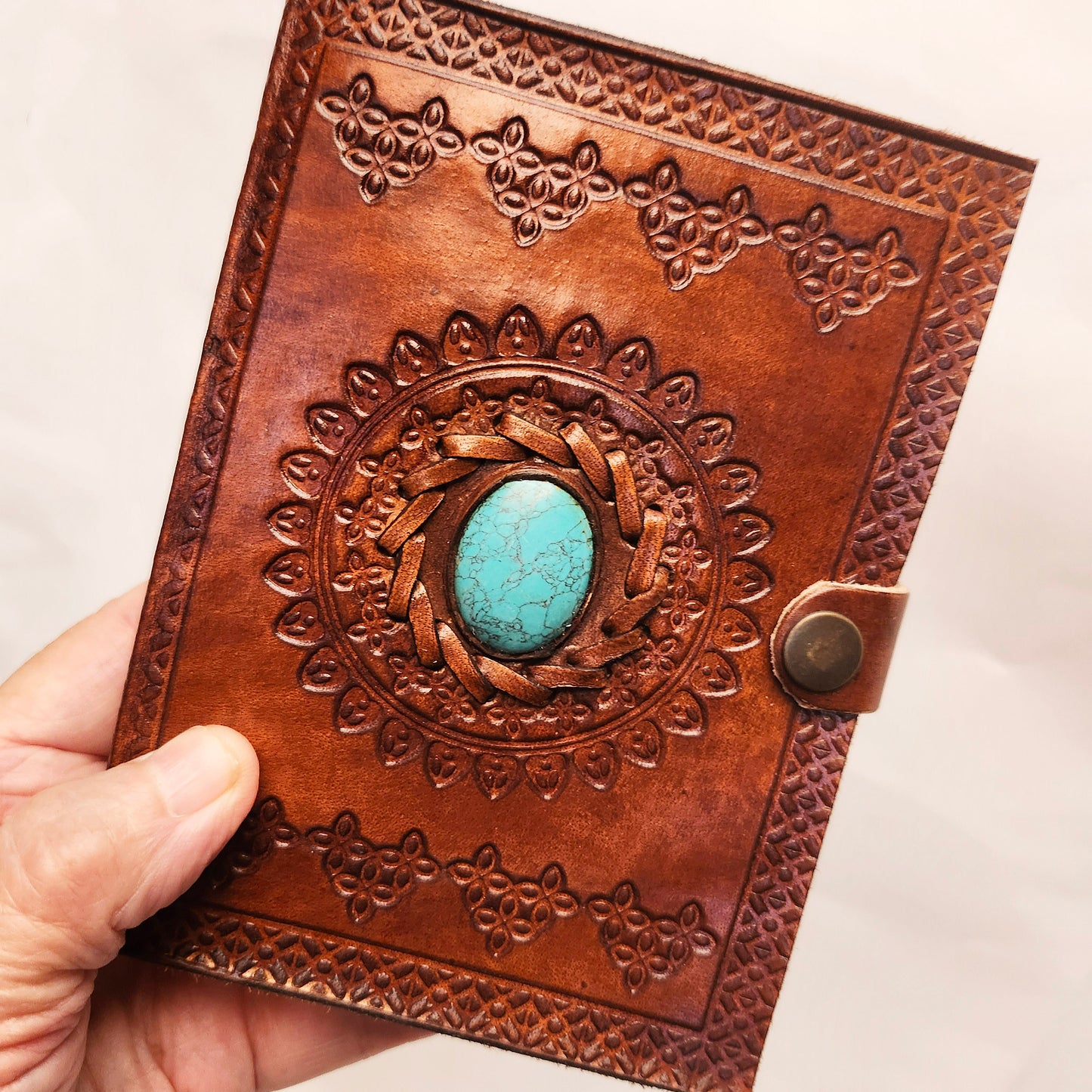 Brown Leather Bound Blank Page Journal with a Turquoise Center Gemstone.