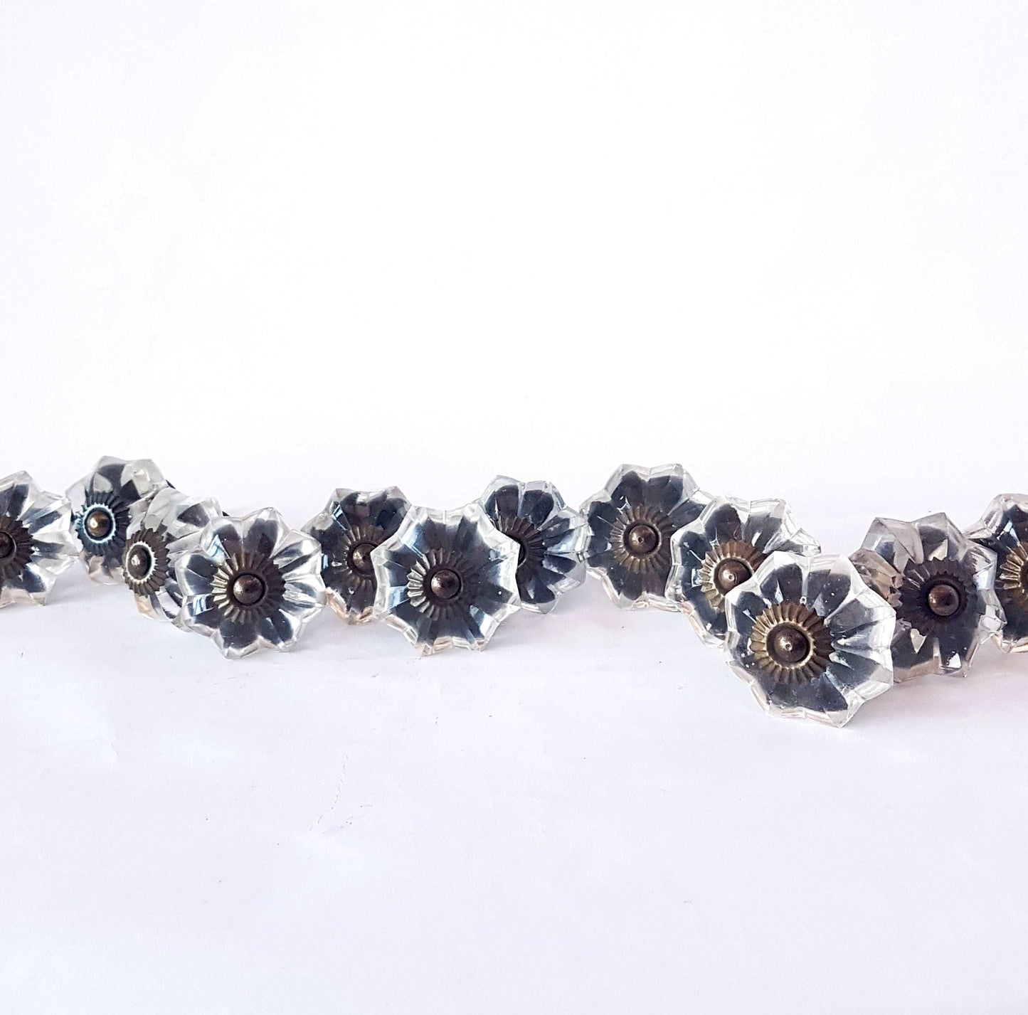 12 clear crystal cabinet knobs. Cut glass pulls in melon shape.