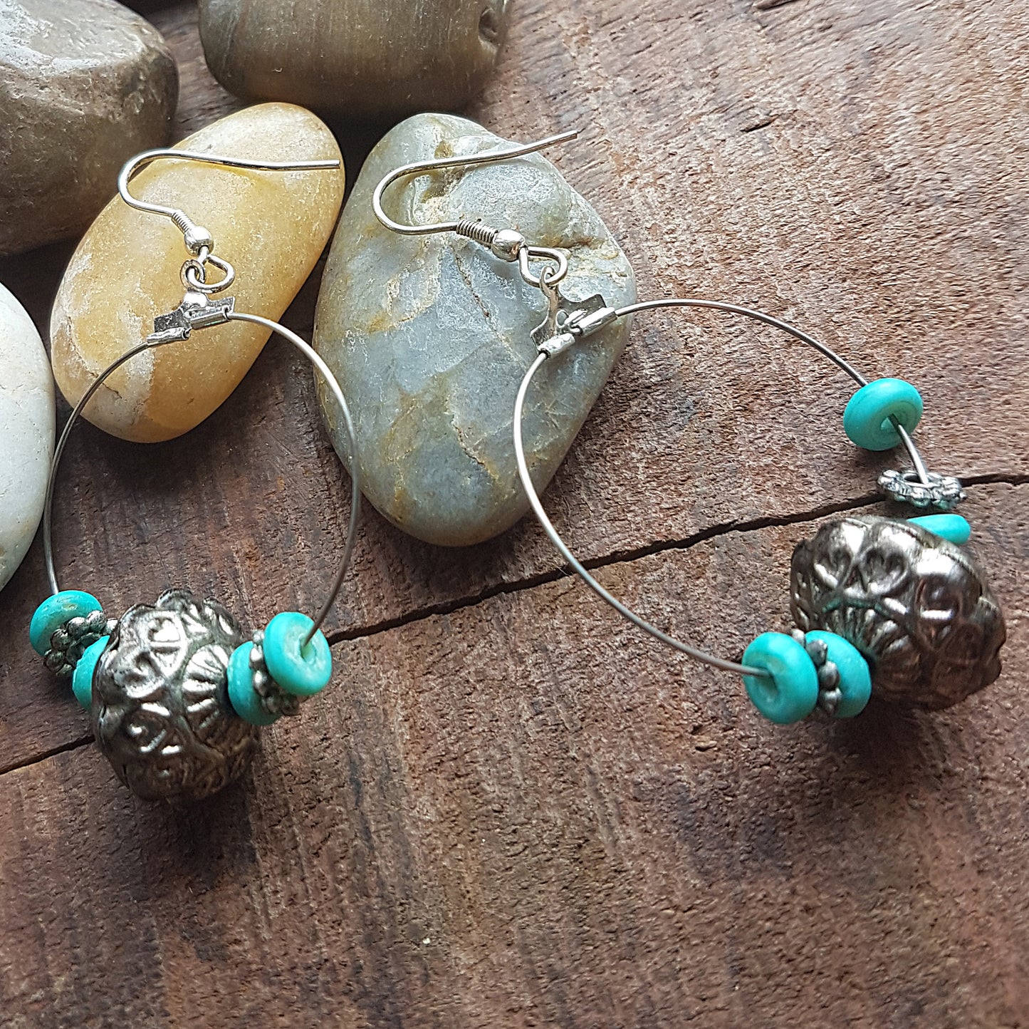 Silver hoop earrings with antique design silver & turquoise beads.