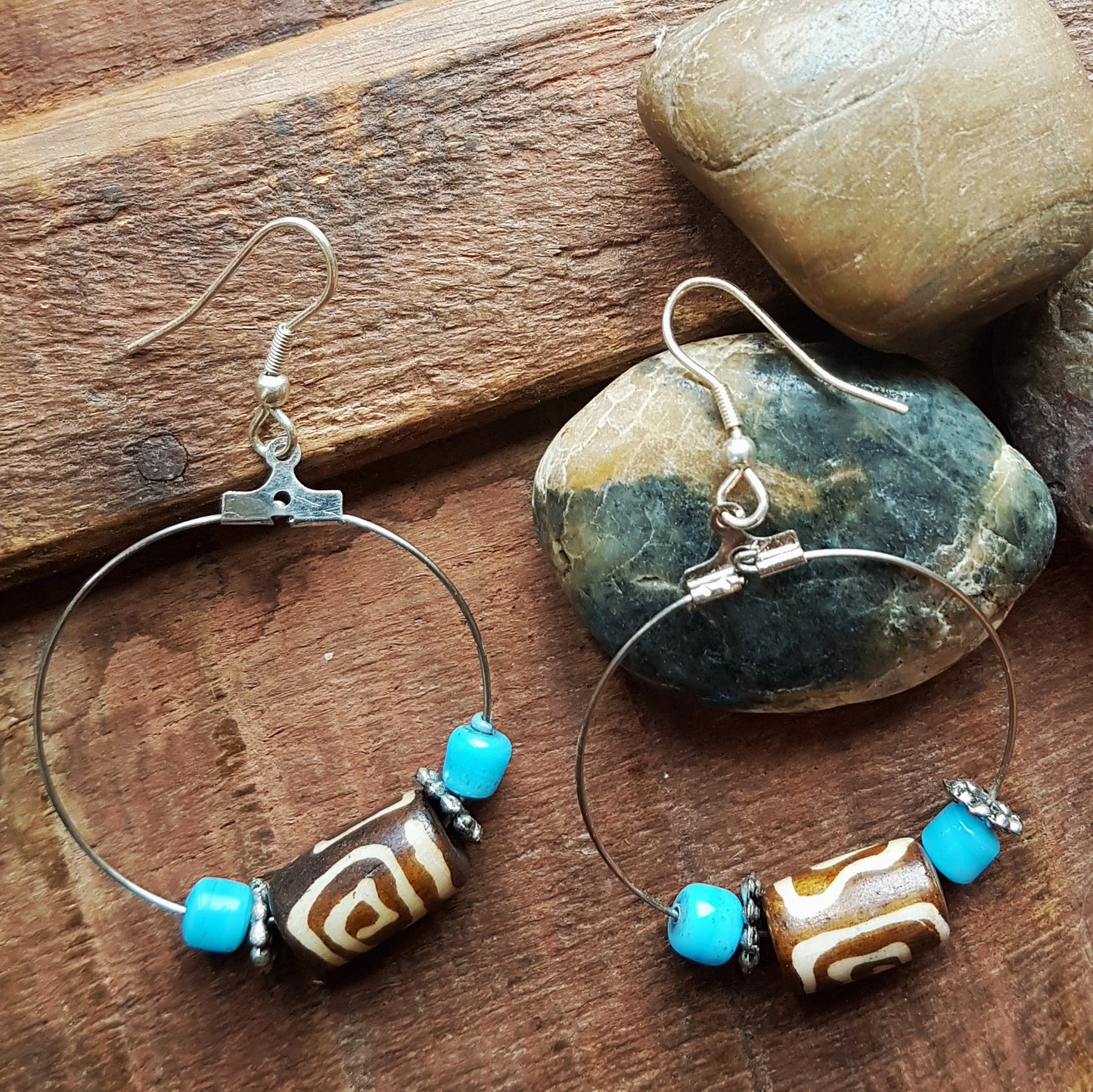 Silver hoop earrings with Dzi bead & small turquoise stones.