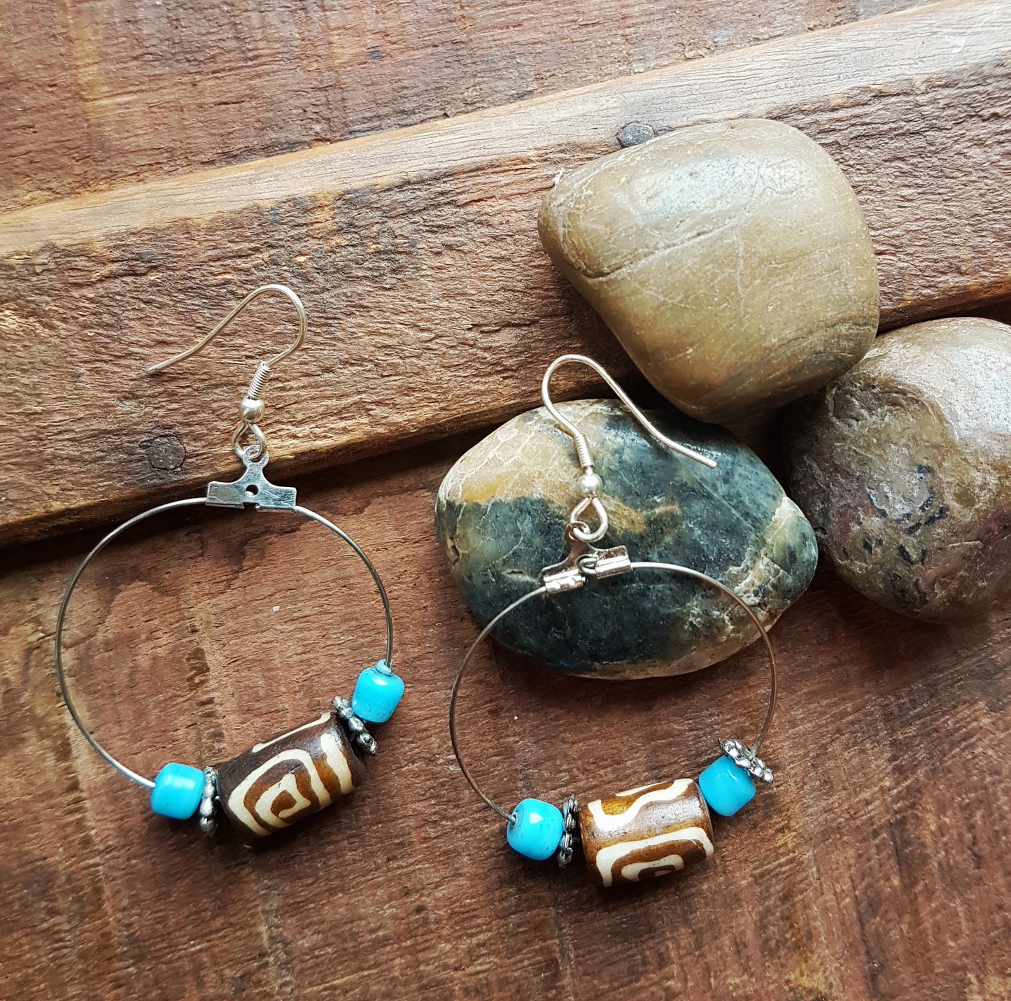 Silver hoop earrings with Dzi bead & small turquoise stones.