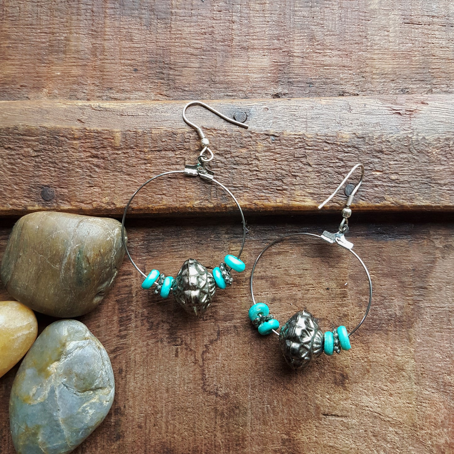 Silver hoop earrings with antique design silver & turquoise beads.