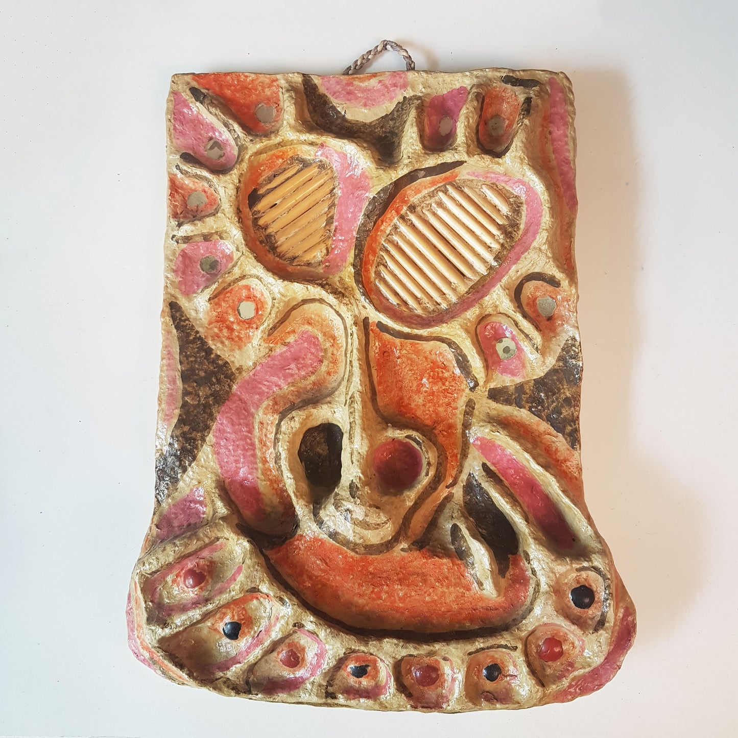 Vintage mixed media wall art mask. Pink and orange. 12 inches high.