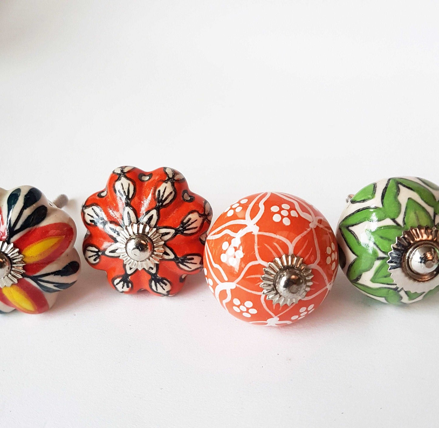 6 cabinet knobs Dolce exclusive collection. Hand painted floral ceramic art. Drawer pulls. one and one half inches in diameter - Vintage India Ca