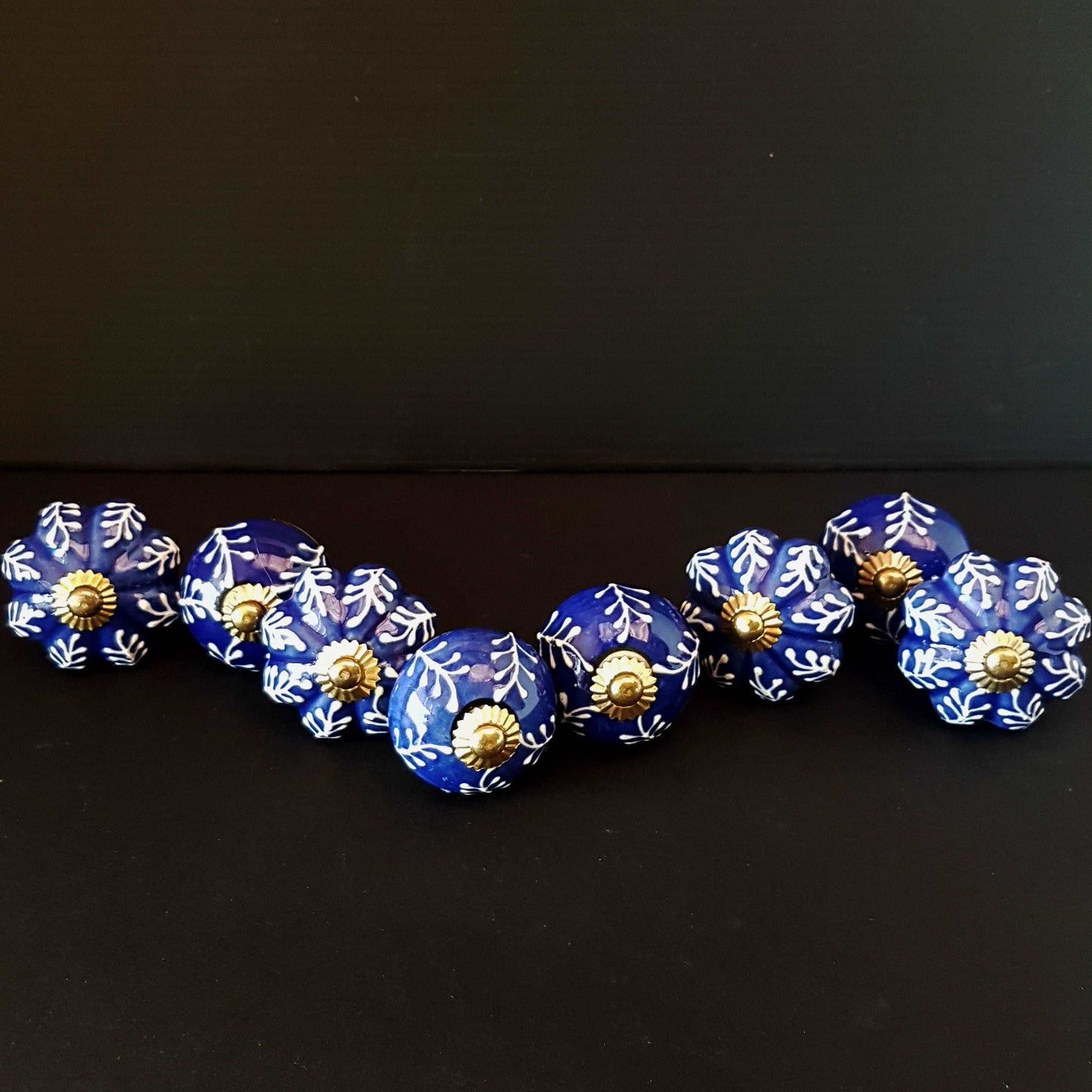 8 Delft cabinet knob drawer pulls in cobalt blue & white hand painted embossed designs. Exclusive Regal Gold 8 piece decorator collection. - Vintage India Ca