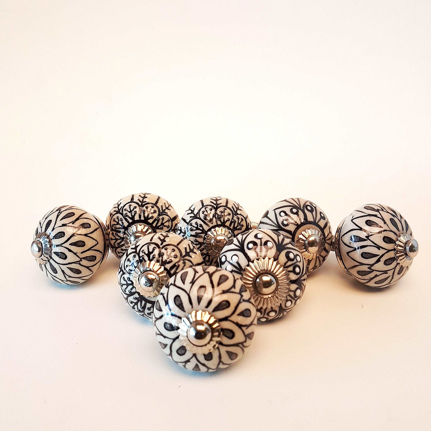 8 cabinet knob-drawer pulls in black, slate grey and cream. Elegance hand painted floral designs with silver hardware.1.5 inch in diameter. - Vintage India Ca