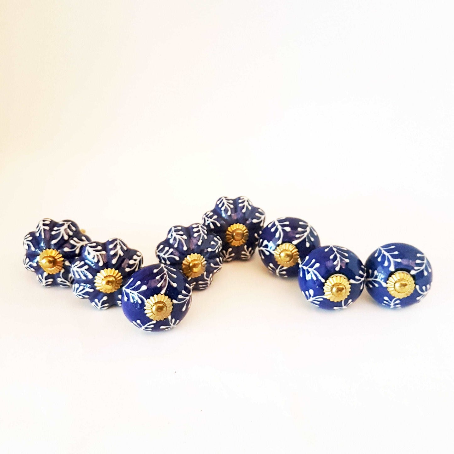 8 Delft cabinet knob drawer pulls in cobalt blue & white hand painted embossed designs. Exclusive Regal Gold 8 piece decorator collection. - Vintage India Ca