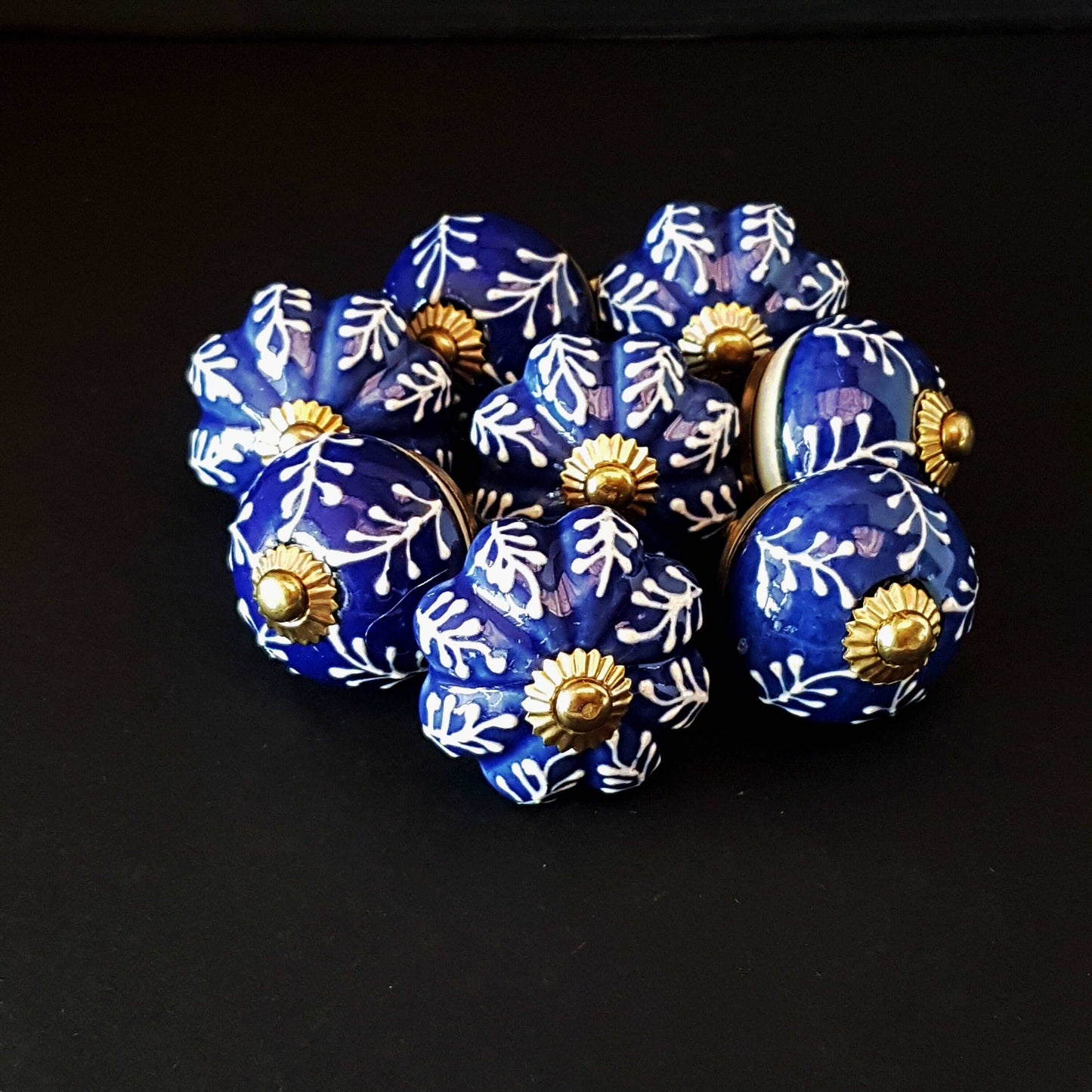 8 Delft cabinet knob drawer pulls in cobalt blue & white hand painted embossed designs. Exclusive Regal Gold 8 piece decorator collection. - Vintage India Ca