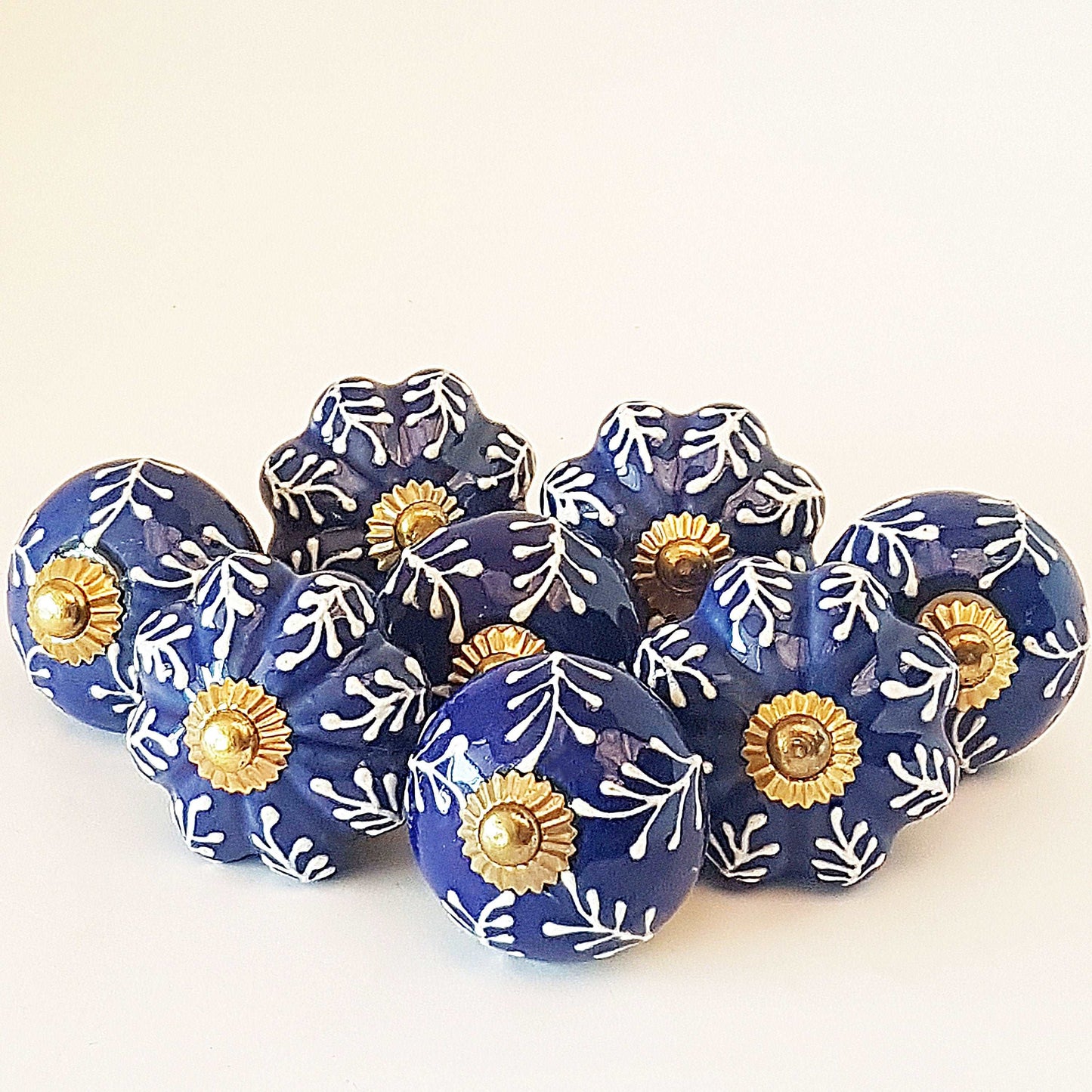 8 Delft cabinet knob drawer pulls in cobalt blue & white hand painted embossed designs. Exclusive Regal Gold 8 piece decorator collection. - Vintage India Ca