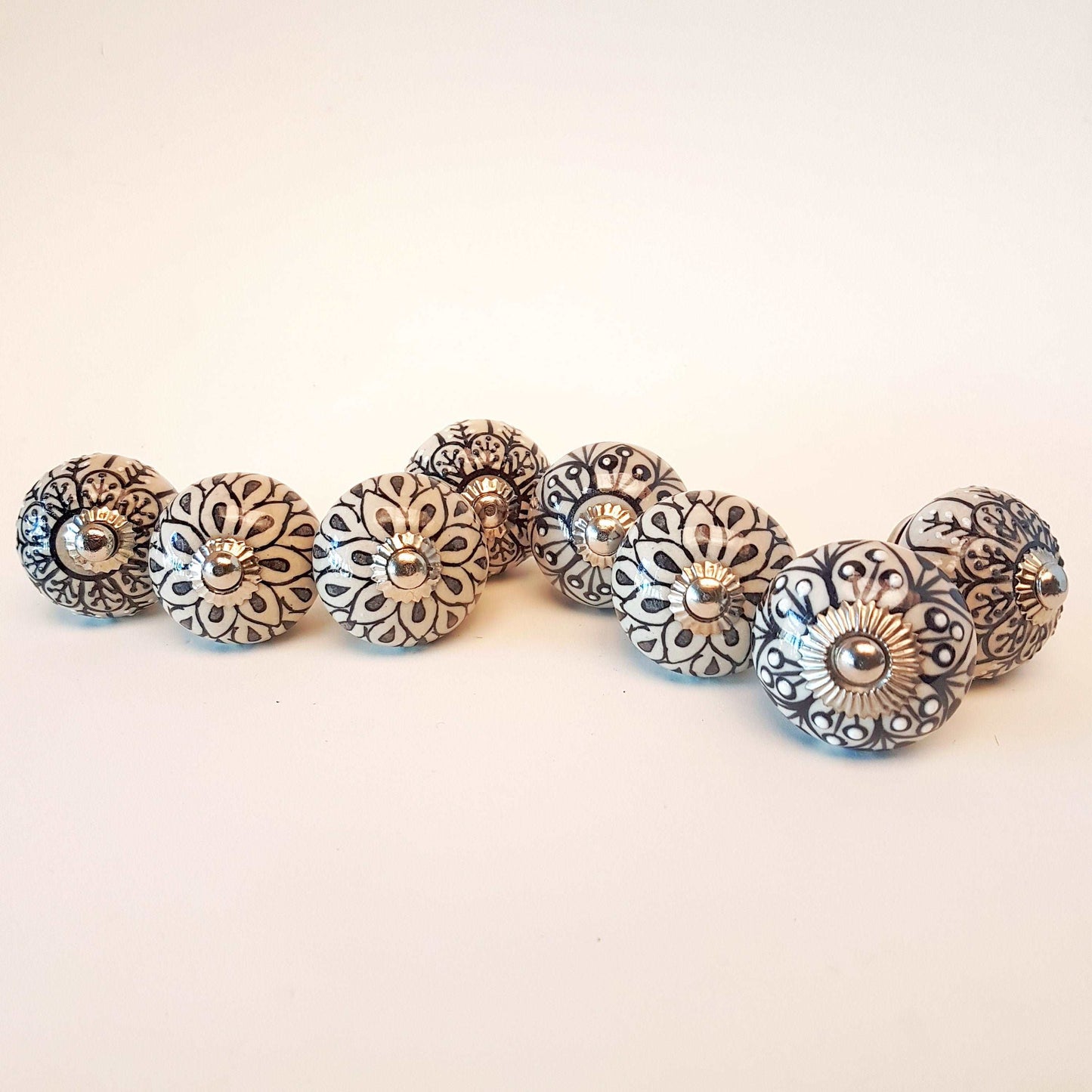 8 cabinet knob-drawer pulls in black, slate grey and cream. Elegance hand painted floral designs with silver hardware.1.5 inch in diameter. - Vintage India Ca