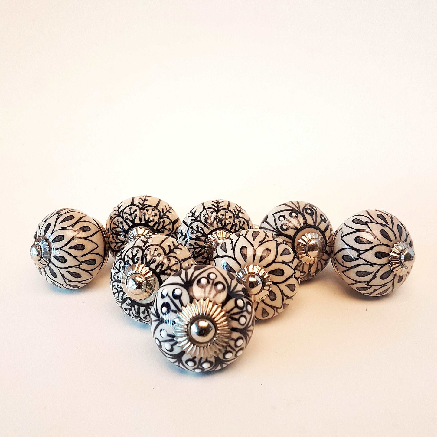 8 cabinet knob-drawer pulls in black, slate grey and cream. Elegance hand painted floral designs with silver hardware.1.5 inch in diameter. - Vintage India Ca