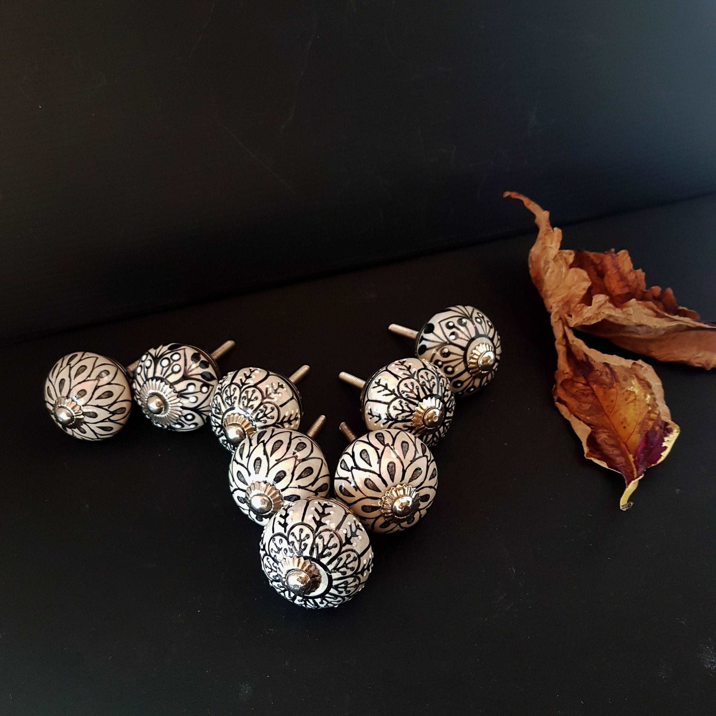 8 cabinet knob-drawer pulls in black, slate grey and cream. Elegance hand painted floral designs with silver hardware.1.5 inch in diameter. - Vintage India Ca