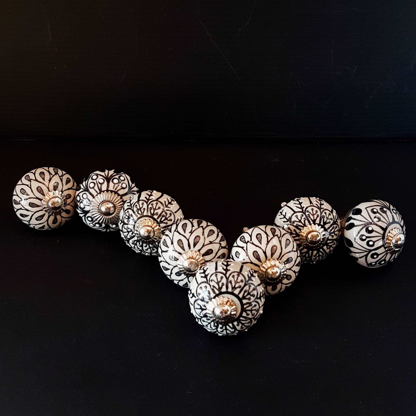 8 cabinet knob-drawer pulls in black, slate grey and cream. Elegance hand painted floral designs with silver hardware.1.5 inch in diameter. - Vintage India Ca