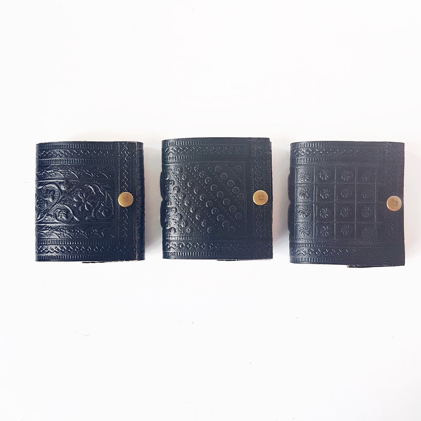Set of 3 cute black leather bound miniature diary journals. Pocket grimoires with hand embossed floral designs 3 inch. Premium paper.