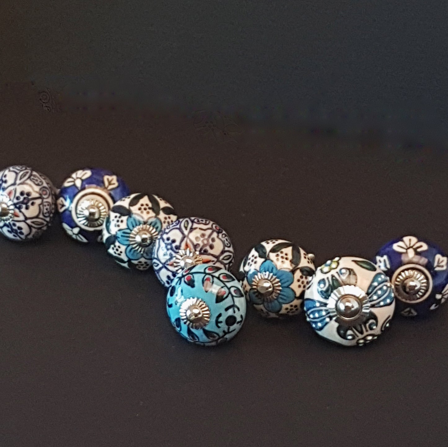 Set of 8 hand painted blue & white cabinet knob drawer pulls in vintage designs.