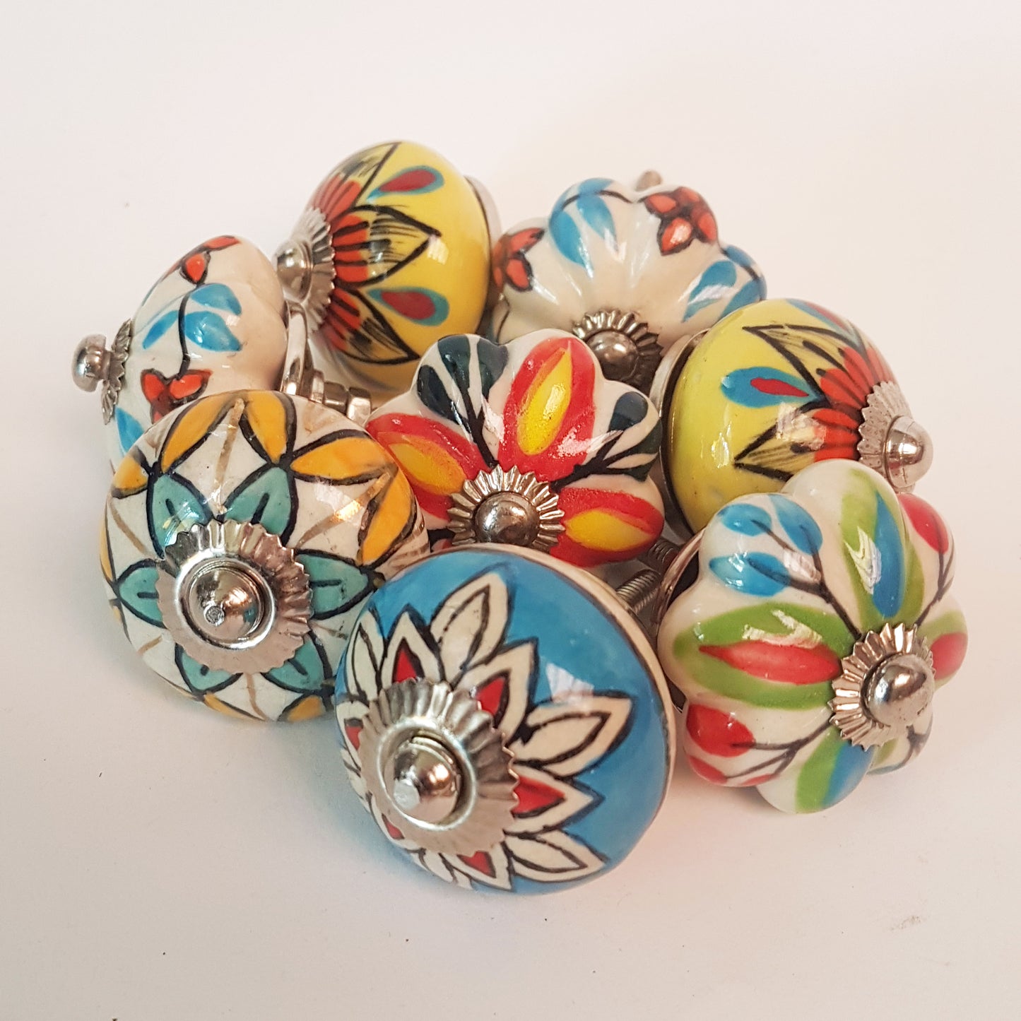 Secret Garden collection of 8 hand painted designer cupboard & drawer knobs in colorful floral patterns. Standard 1.5 inch diameter size.