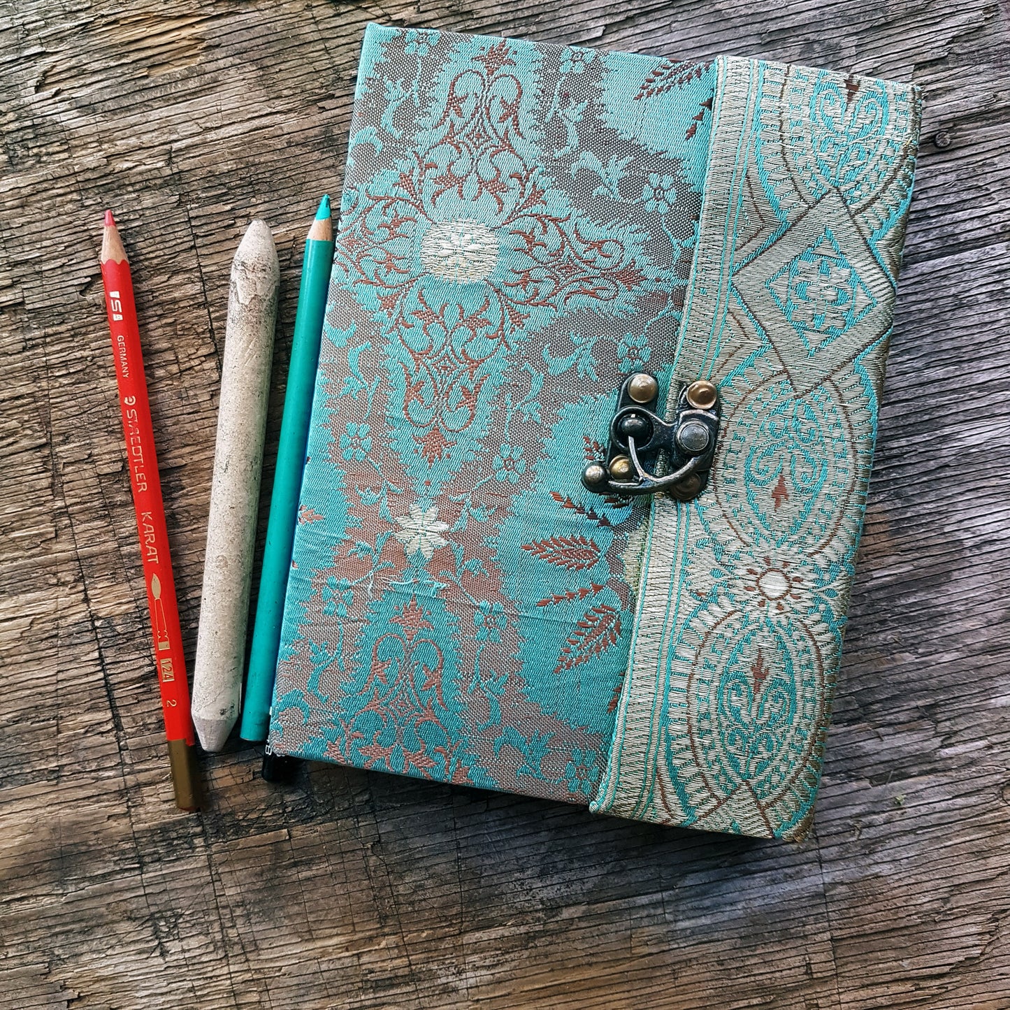 Vintage fabric cover sketchbook journal 5 by 7 inches. One of a kind blank book with premium paper pages. Medieval look bronze metal lock closure.