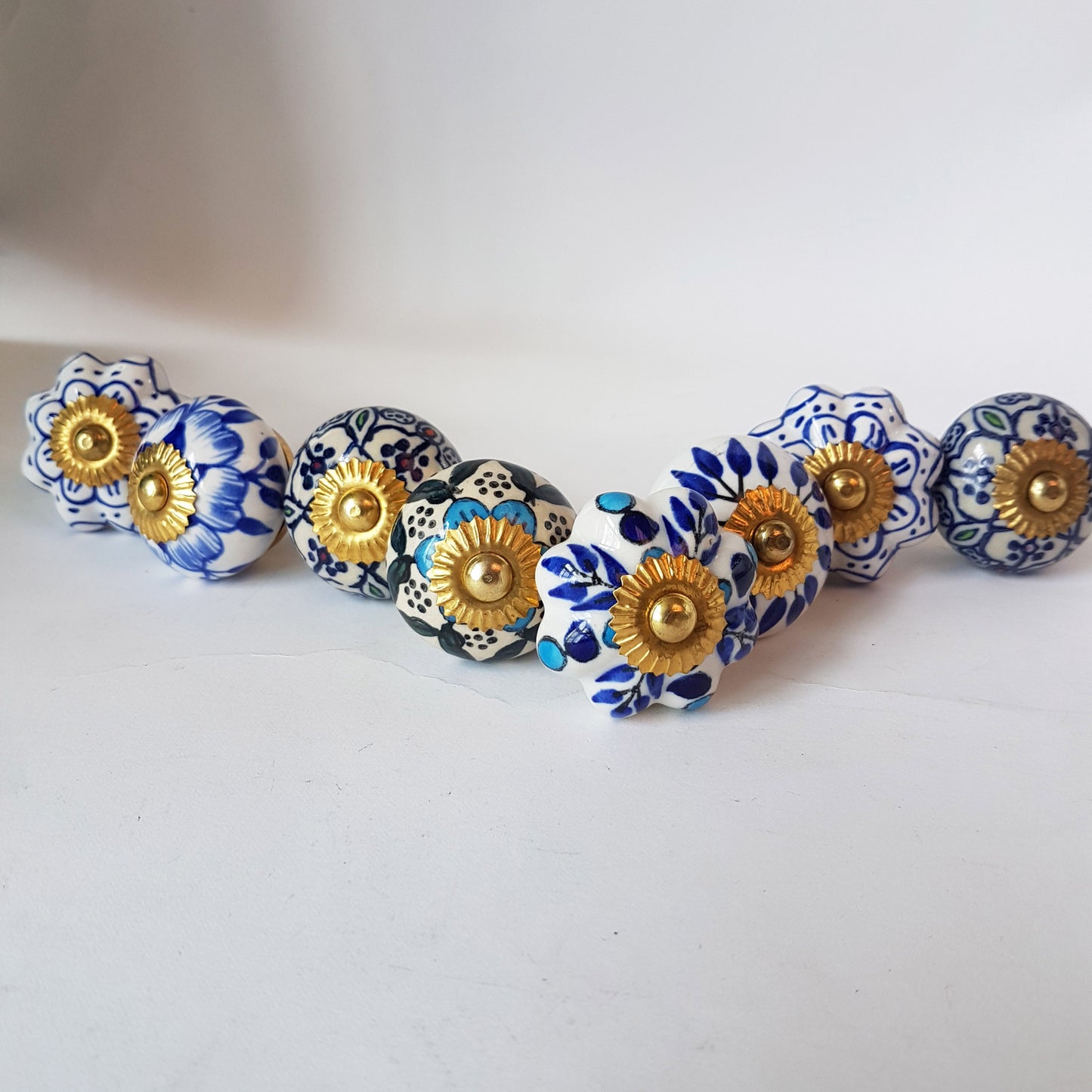 Delphine set of 8 cabinet knob drawer pulls. Designer collection in classic Delft Dutch blue & white floral patterns. Easy DIY decor fix!